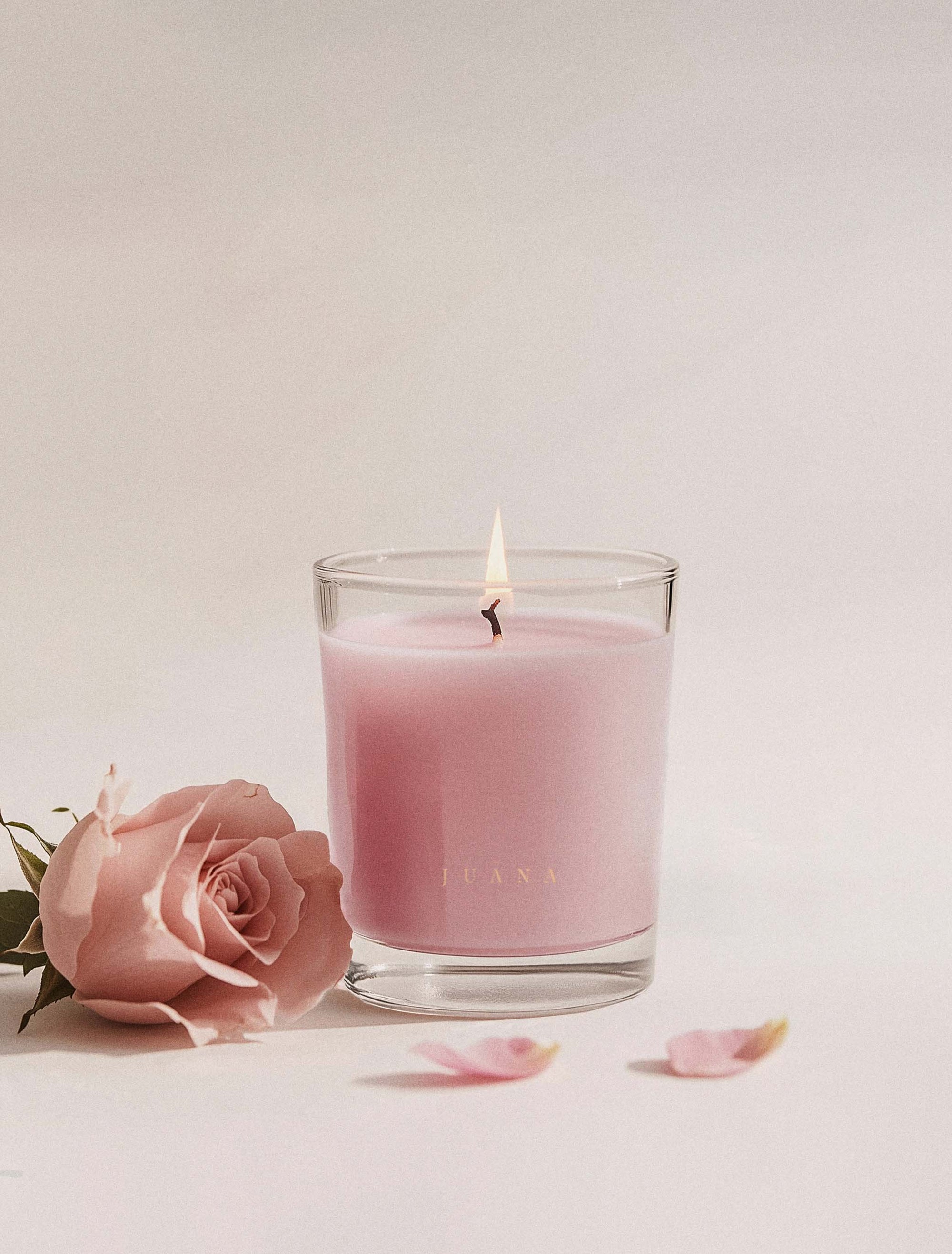 Juana Rose+Jasmine Romance Arouse apothecary candle in jar with rose petal, minimal styling, vegan coco-apricot wax.