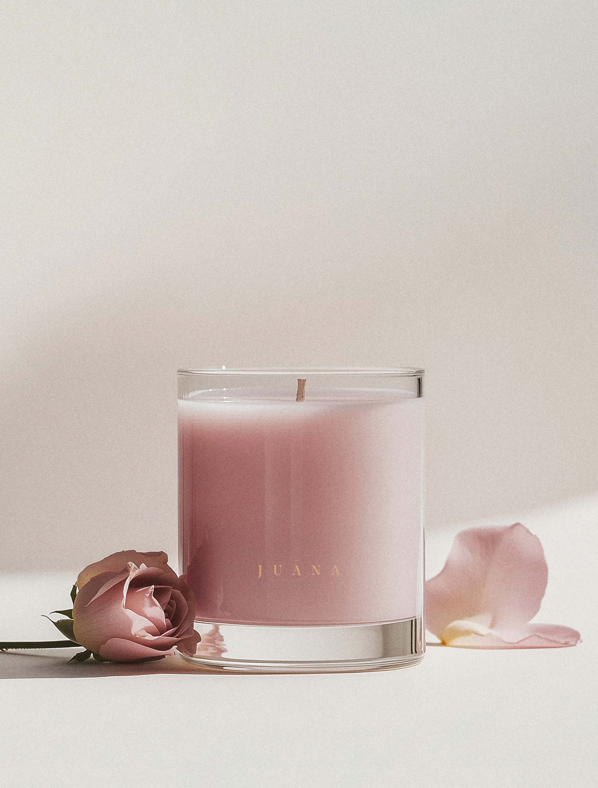Juana Rose+Jasmine Arouse apothecary medium candle in jar with rose petal, minimal styling, vegan coco-apricot wax.