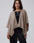 Detail shot of edge finish and knit texture on Juana Cashmere Cape (oatmeal), emphasizing quality and drape.