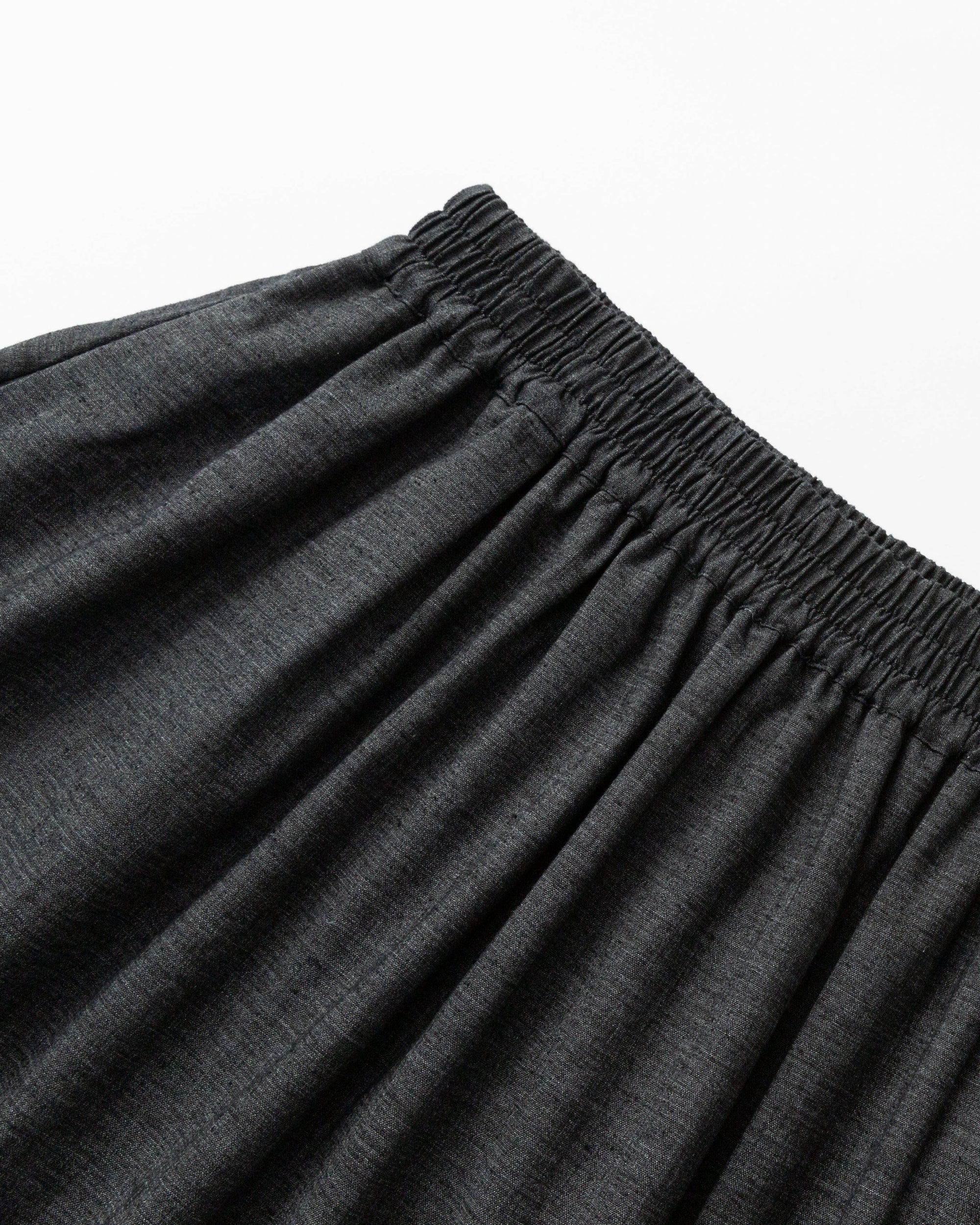 Detail shot of pleat stitching, waistband on Hemp Blend Maxi Skirt (black).