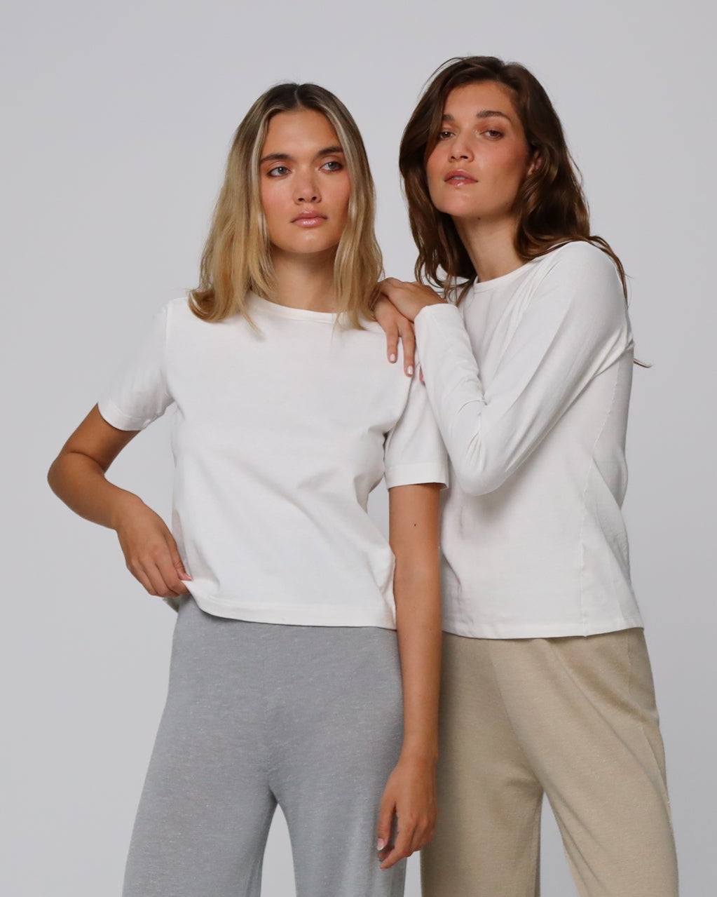 Woman wearing Juana Hemp Essentials Short Sleeve Tee in white hemp–organic cotton stretch blend, styled for sustainable everyday wear.