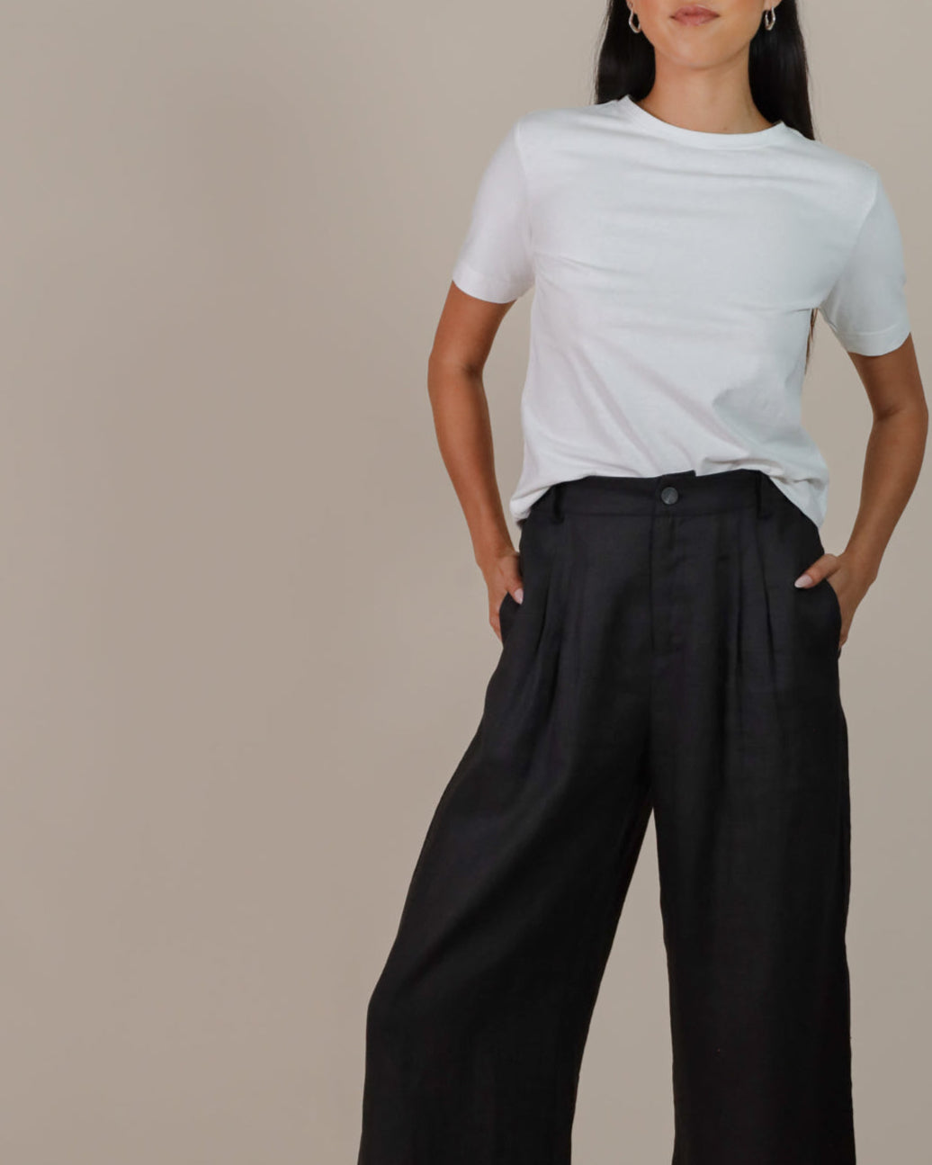Woman wearing Juana Hemp High Rise Pants, tailored from 100% hemp in a flattering high-rise silhouette.