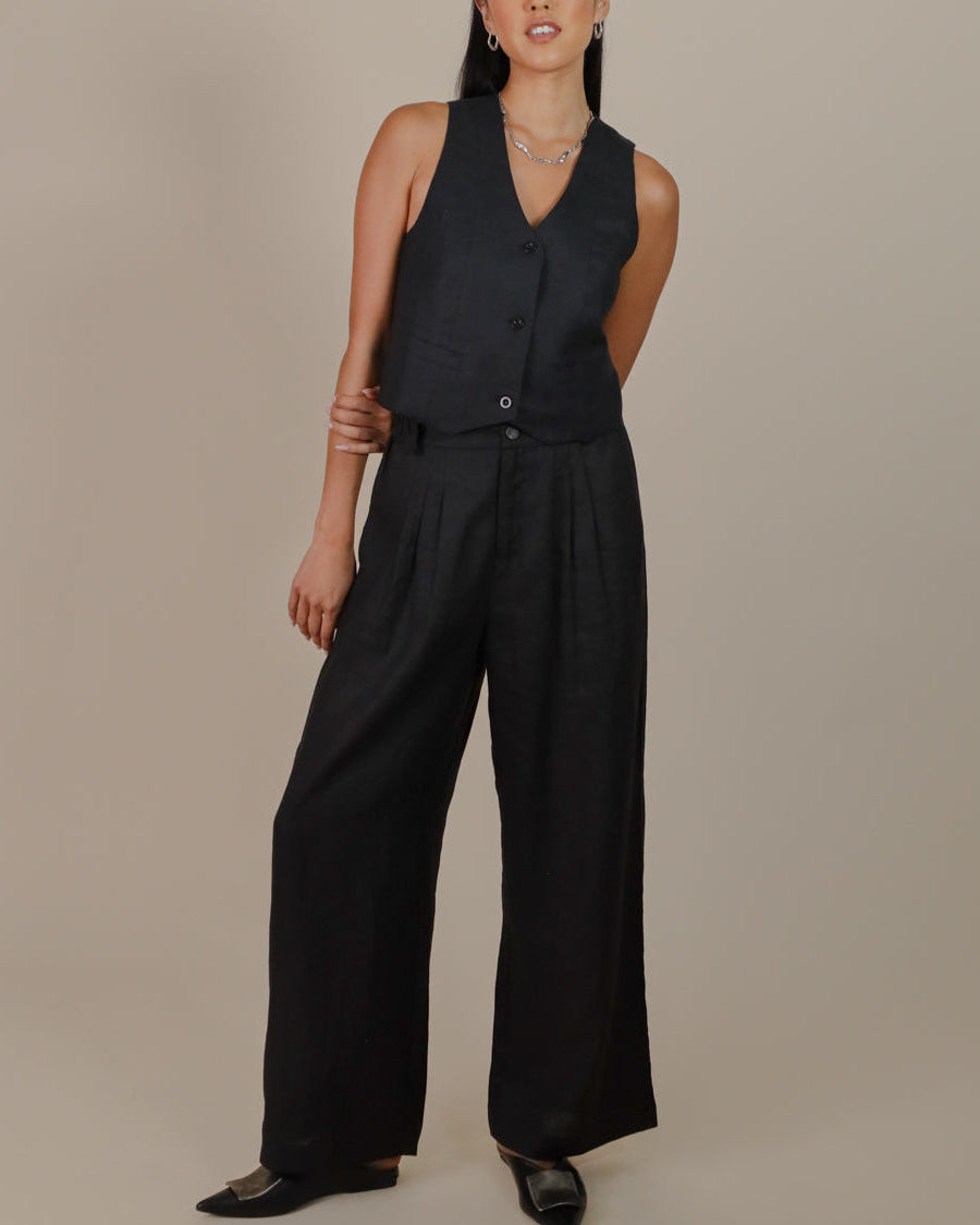 Model styling Juana Hemp High Rise Pants with matching hemp vest for a coordinated sustainable outfit.