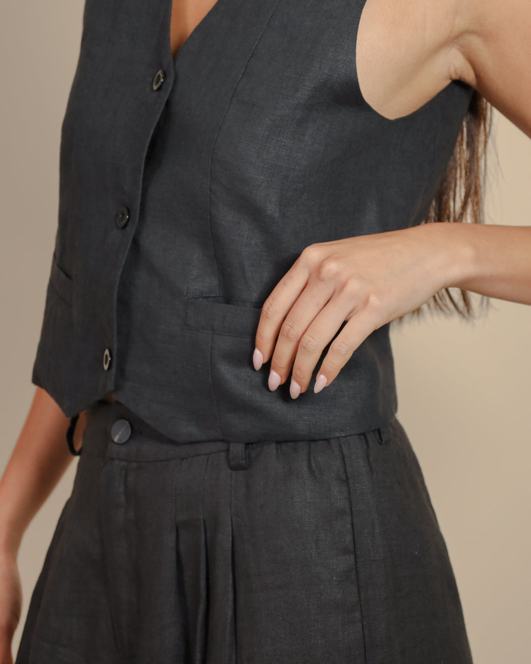Details of Juana Hemp Vest, showing hemp fabric texture and corozo buttons.
