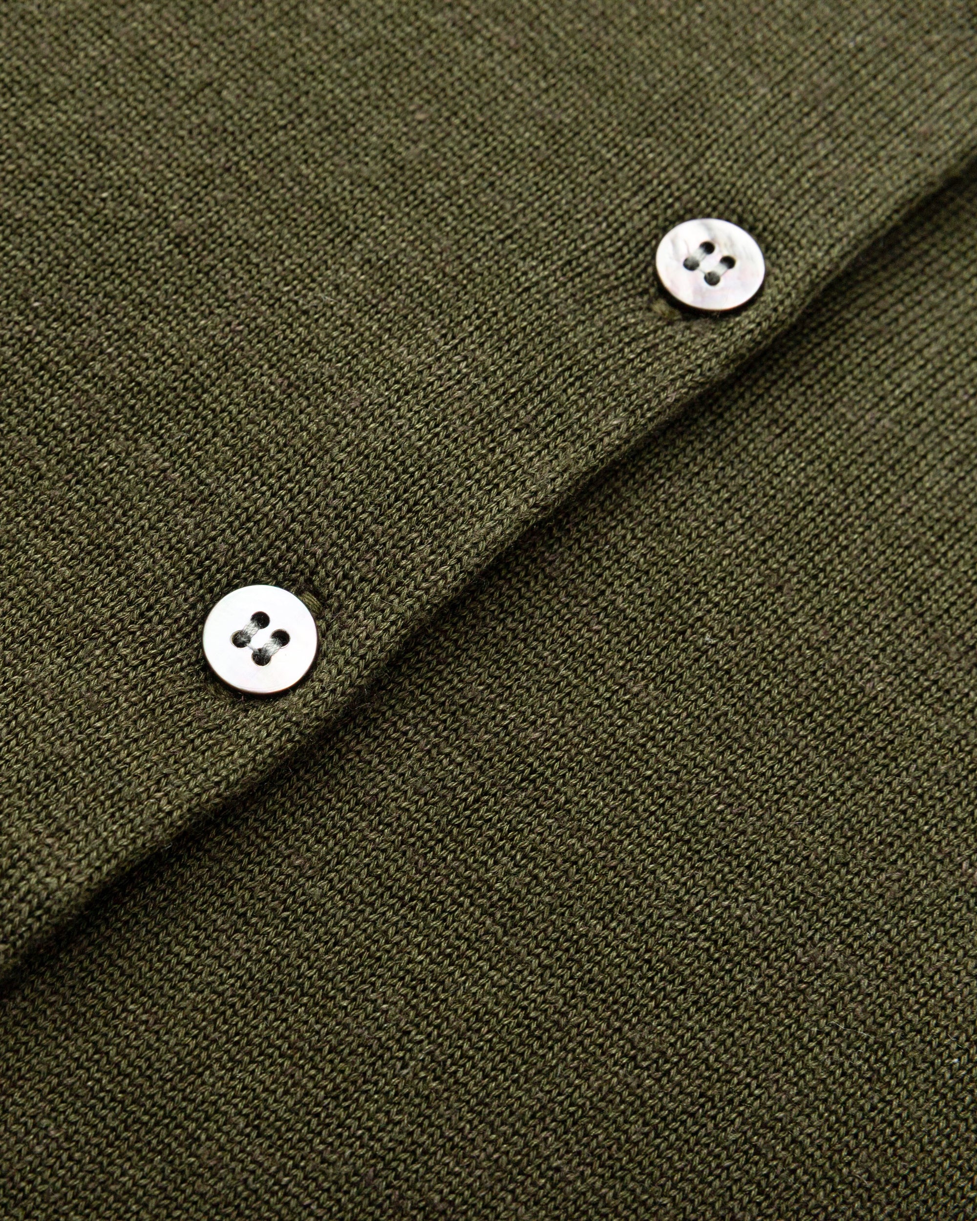 Flat lay of Liora Knitted Hemp Cardigan (camo green), showing knit structure and finishing.