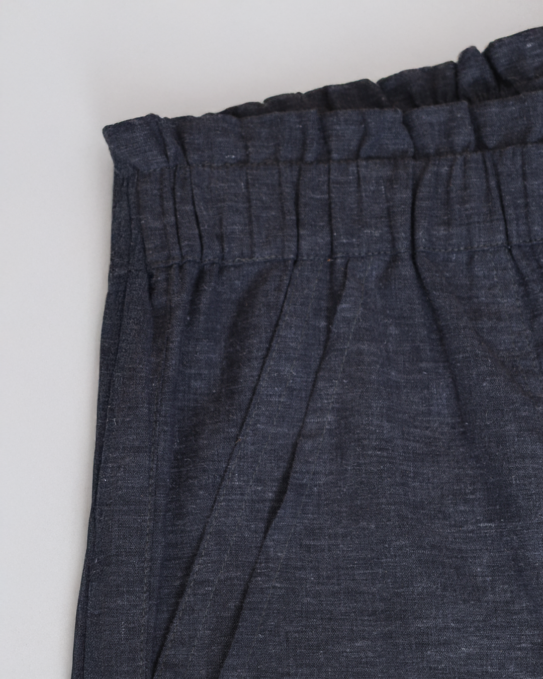 Flat lay of Juana Lyricist High Rise Pull-on Pants showing hemp and Tencel™ fabric texture and waistband detail.