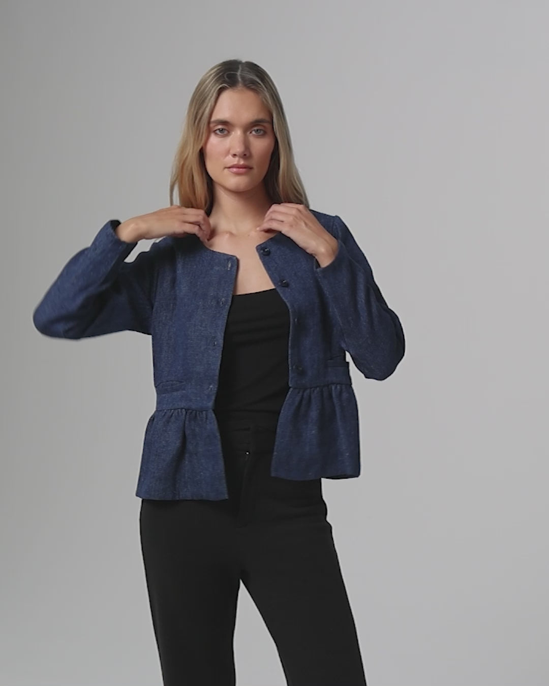 360Β° video of model wearing Denim Atelier Peplum Jacket (blue denim), showing silhouette, drape, and movement.