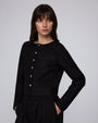 Full-body view of Aella Long Sleeve Woven Top (black) paired with Aella Mid Rise Relaxed Pants for a matching set.