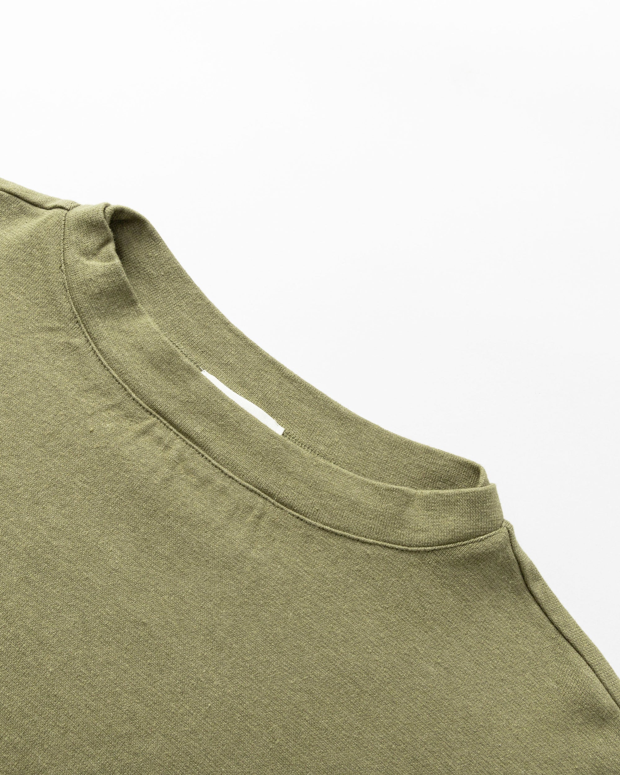 Flat lay close-up neckline of Juana Aera Organic Cotton Boxy Sweater, showing structure and ribbed detailing. 