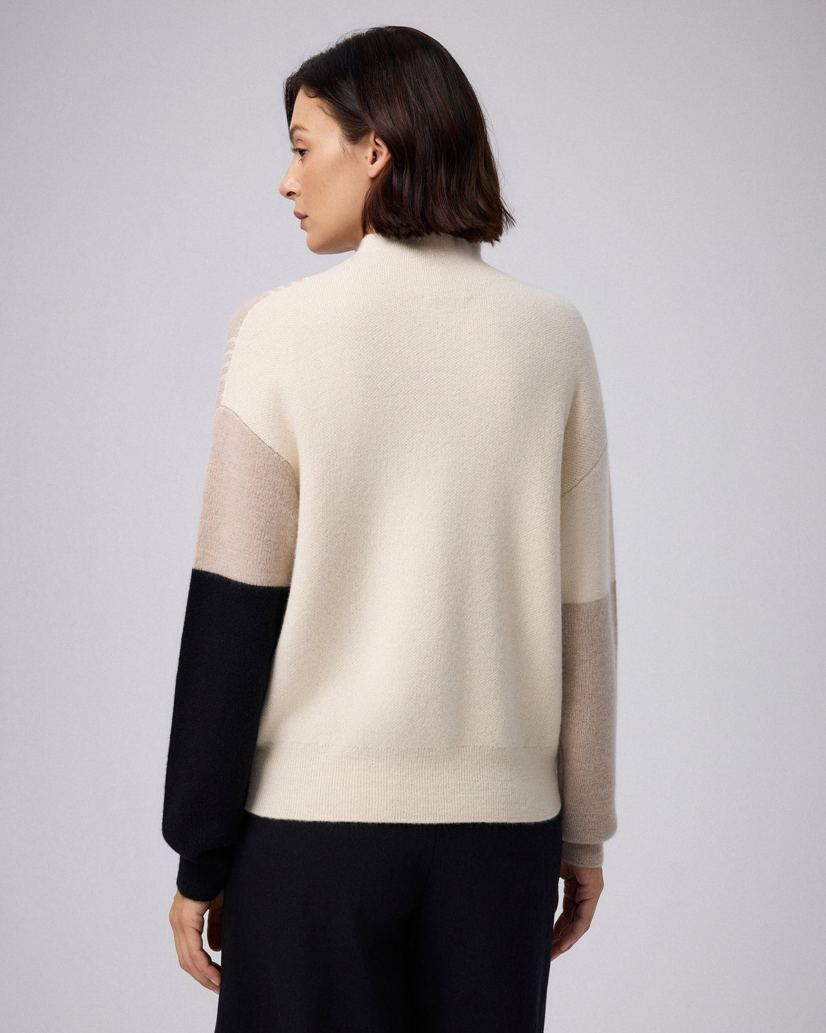 Juana Alpaca Crewneck Sweater in Cream/Black (baby alpaca wool–knit) shown from the back with a longer hemline.
