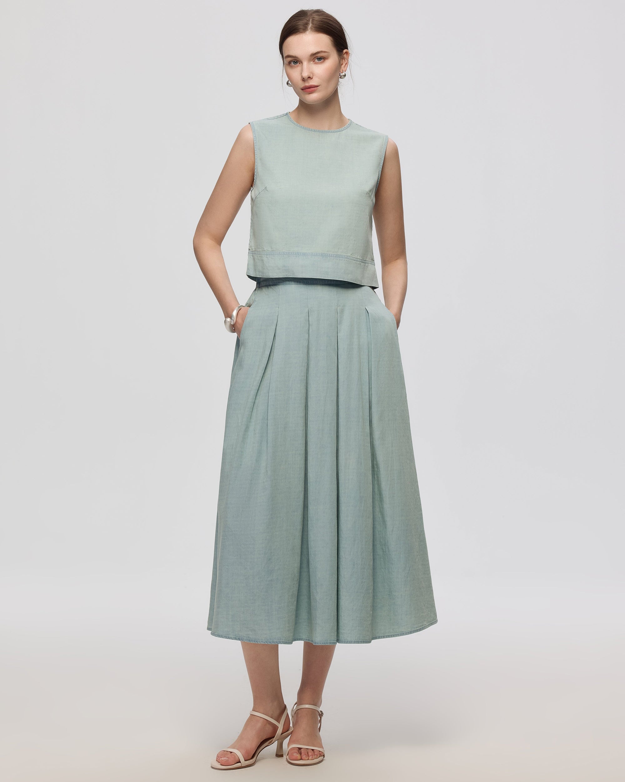 Juana Amaia Pleated Maxi Skirt Chambray blue (sustainable tencel–cotton–hemp) model front view showing fluid drape