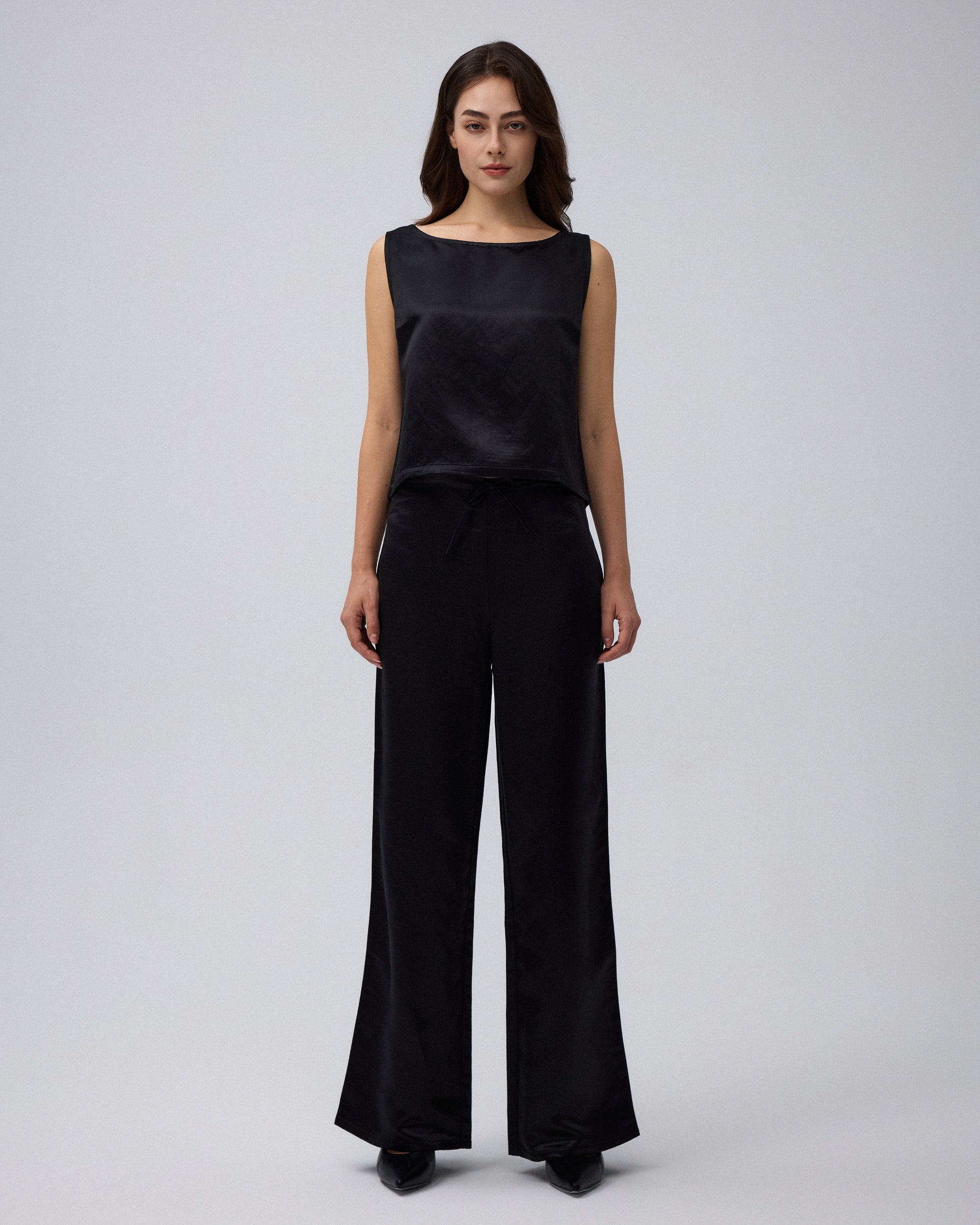 Juana Aven Silk Tank in Black (hemp–silk) styled in a complete look with its clean sleeveless silhouette visible