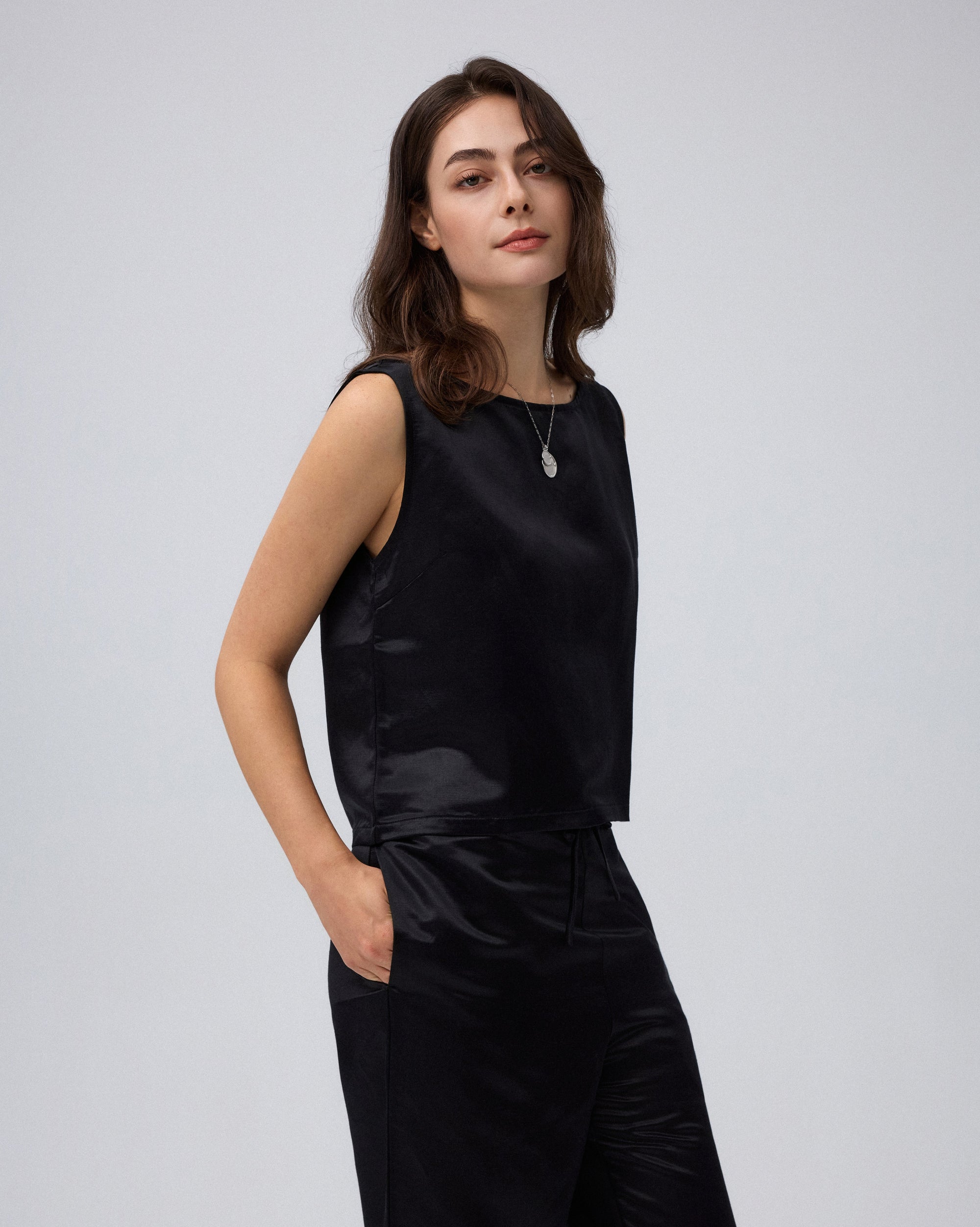 Juana Aven Silk Tank in Black (hemp–silk) styled as a lightweight layering piece with a refined shell silhouette
