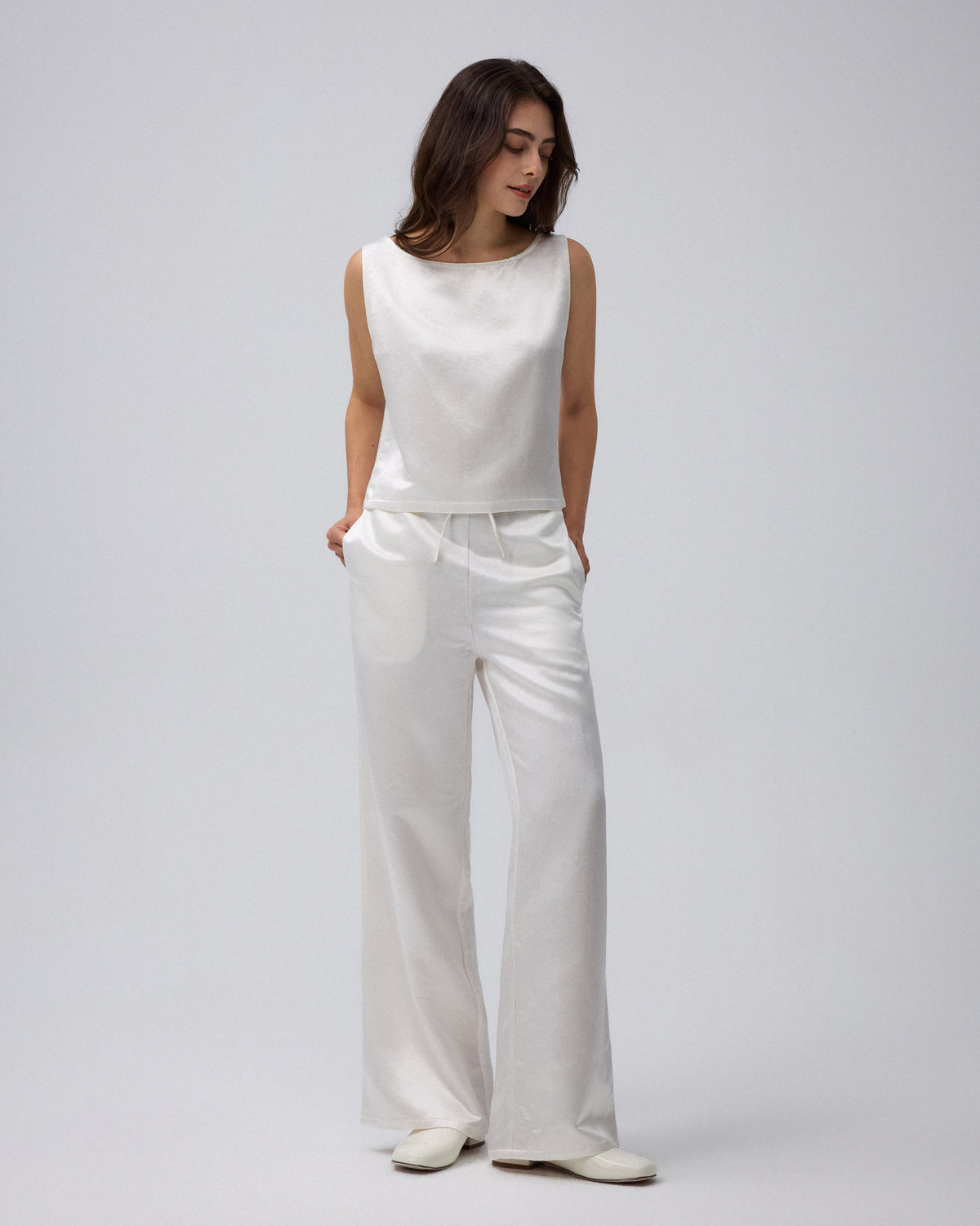 Juana Aven Silk Tank in Pearl White (hemp–silk) styled in a complete look with its clean sleeveless silhouette visible