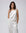 Juana Aven Silk Tank in Pearl White (hemp–silk) styled as a lightweight layering piece with a refined shell silhouette