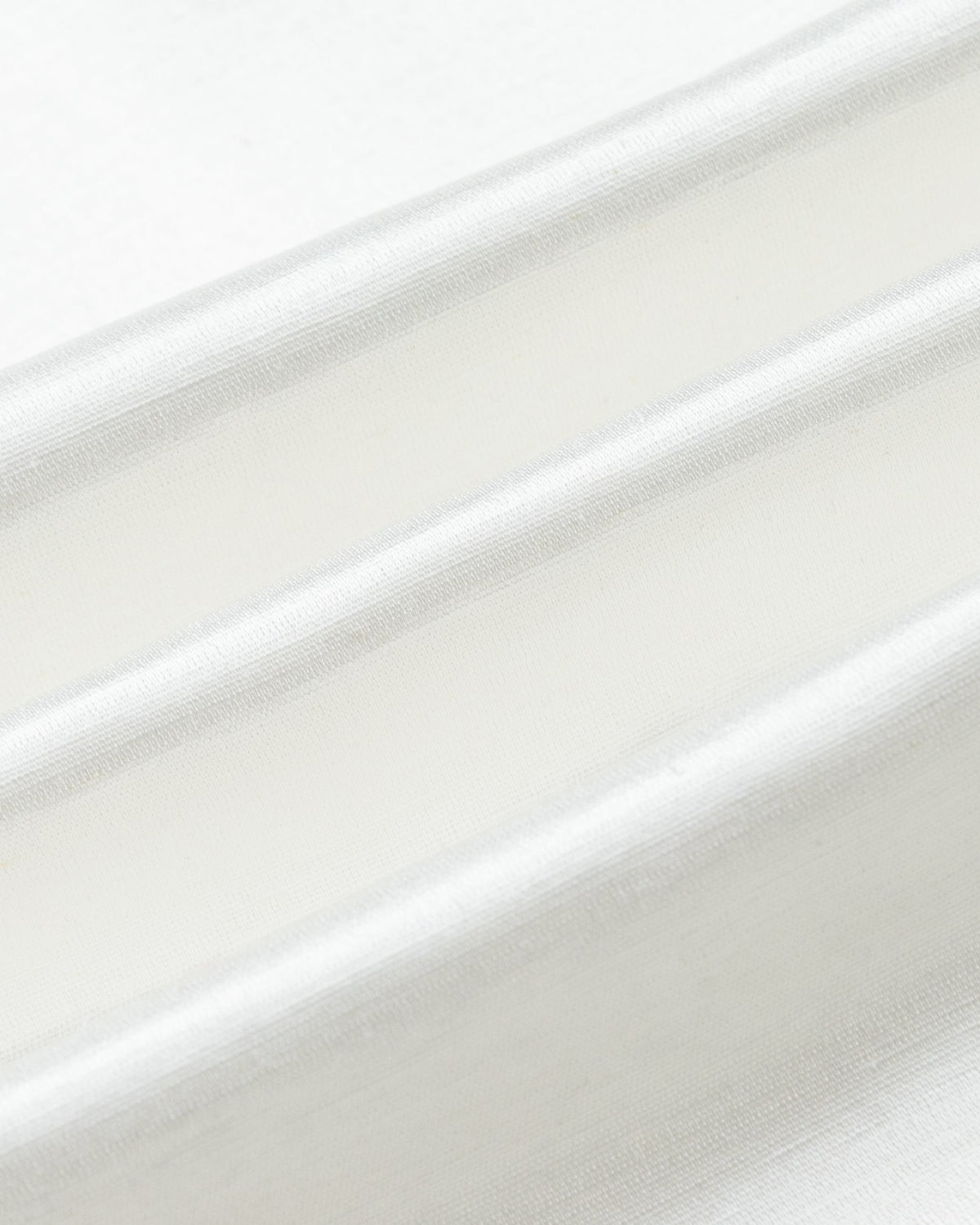 Juana Aven Silk Tank in Pearl White (hemp–silk) showing the smooth woven texture and subtle luster