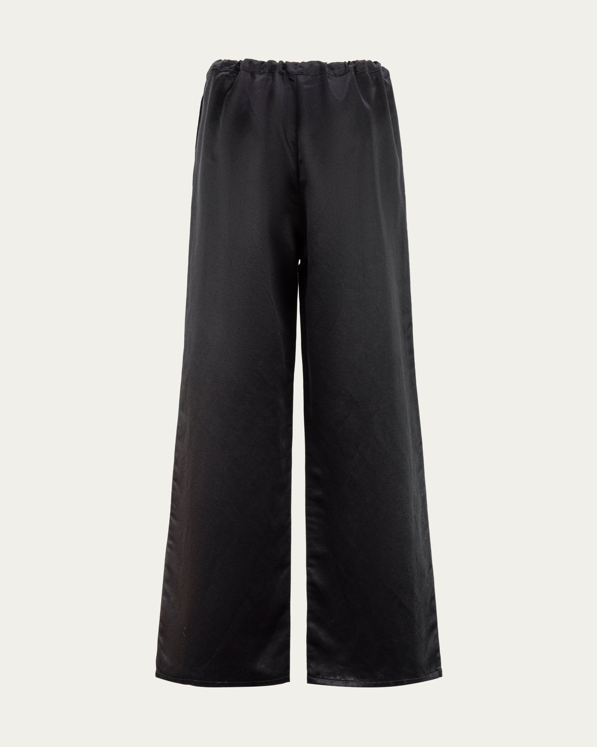 Juana Aven Wide Leg Pants in Black (hemp–silk) shown from the back with a clean waist and full-length silhouette.
