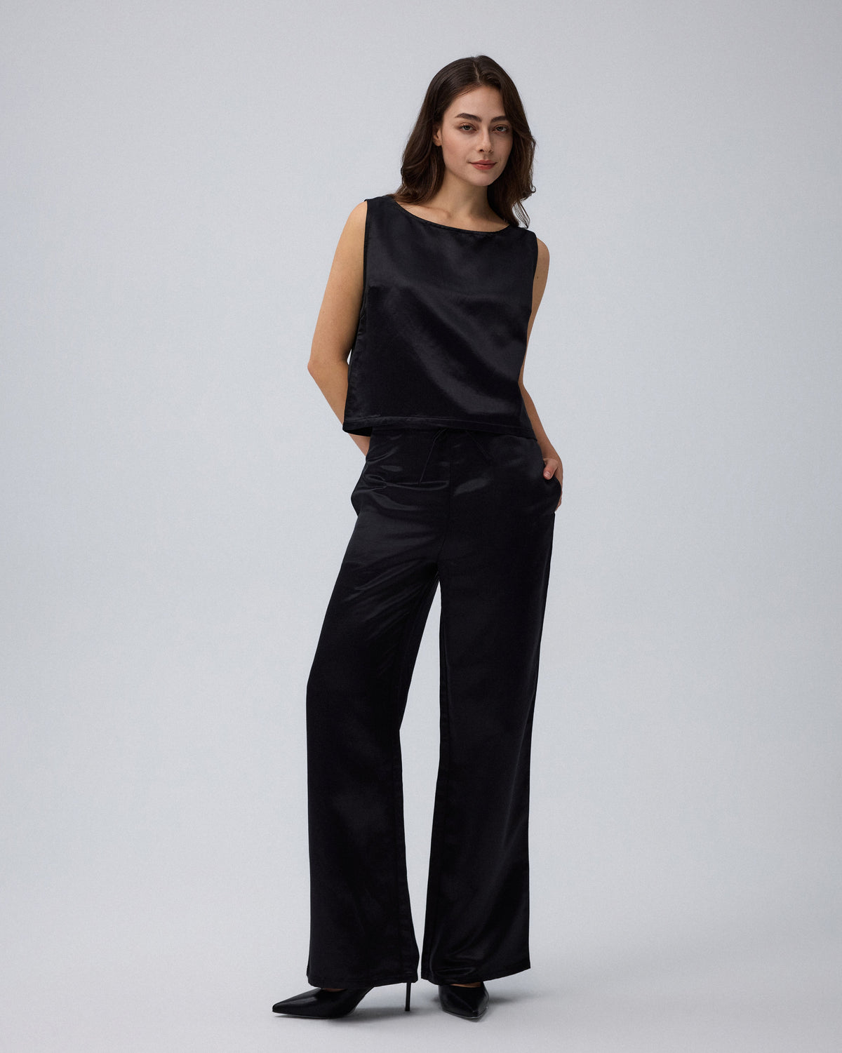 Juana Aven Wide Leg Pants in Black (hemp–silk) shown in motion with a relaxed wide-leg drape.
