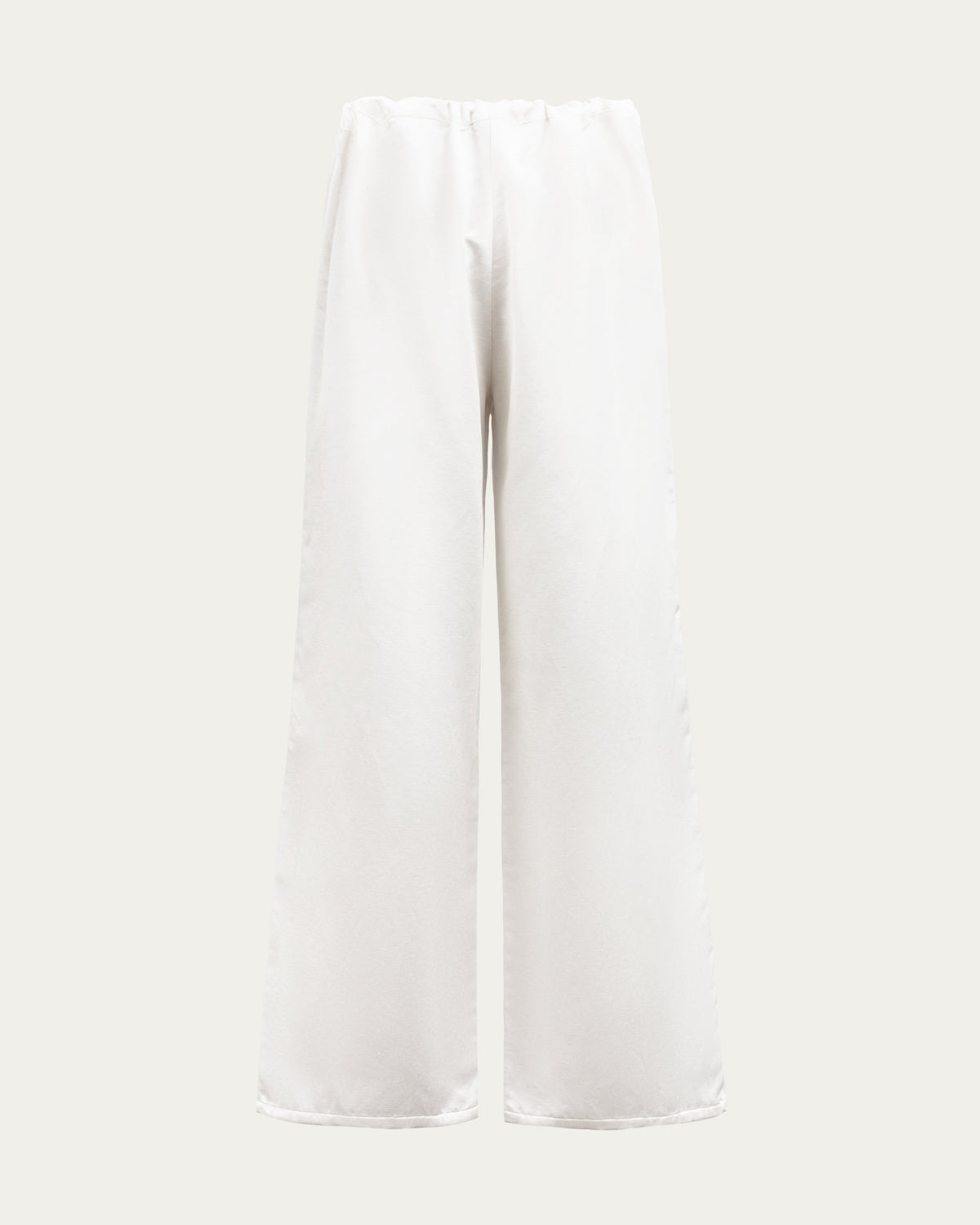 Juana Aven Wide Leg Pants in Pearl White (hemp–silk) shown from the back with a clean waist and full-length silhouette.