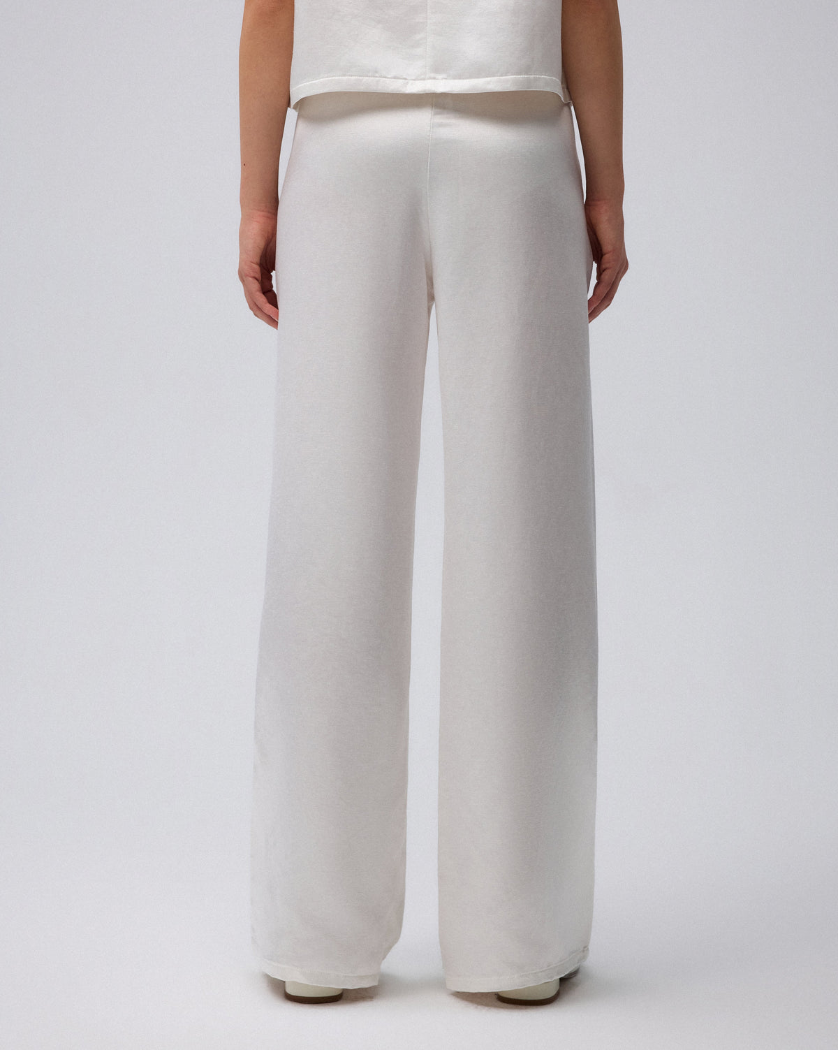 Juana Aven Wide Leg Pants in Pearl White (hemp–silk) detail view showing the handcrafted drawstring and deep side pocket.