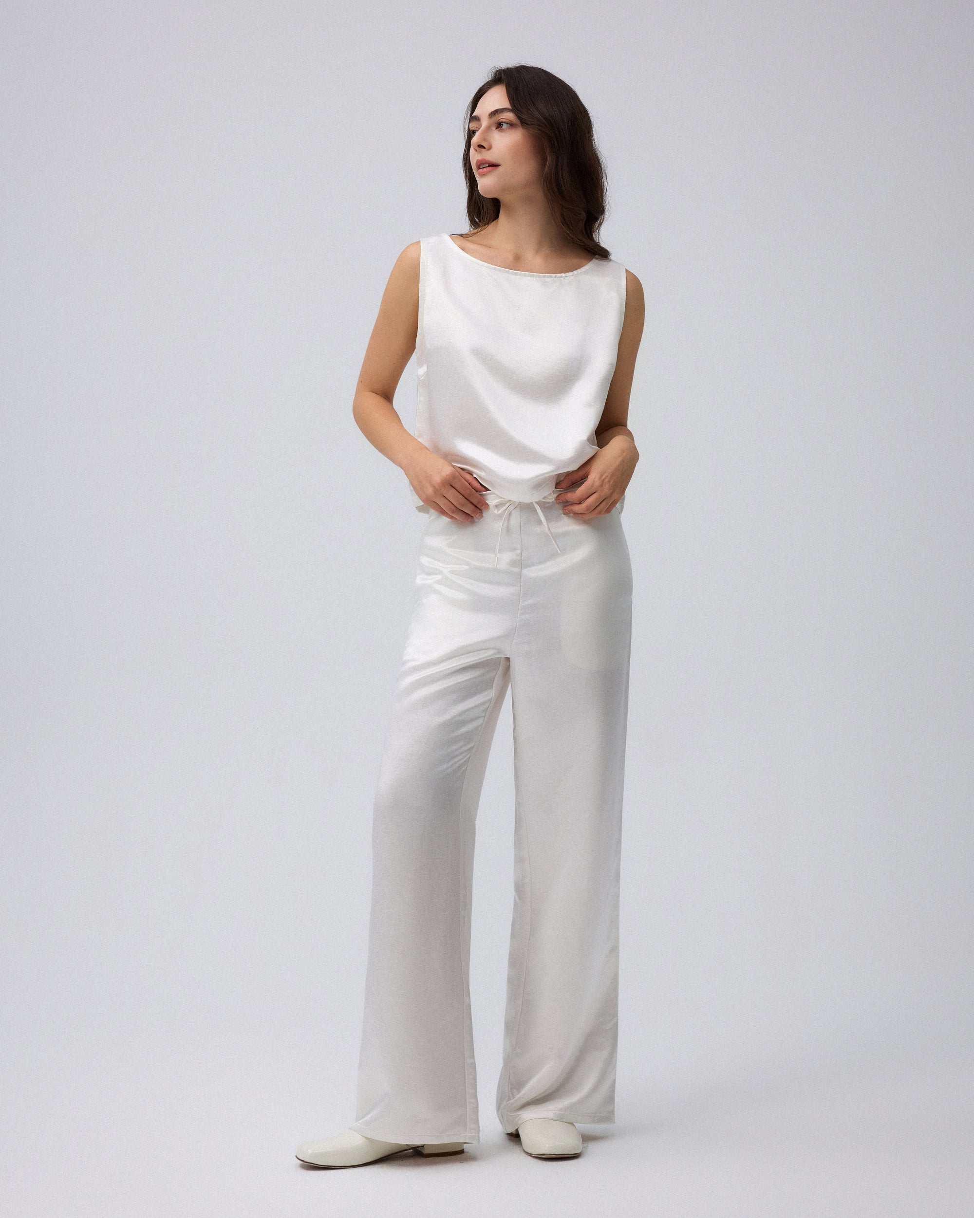 Juana Aven Wide Leg Pants in Pearl White (hemp–silk) modeled from the front to show the high-rise wide-leg fit.
