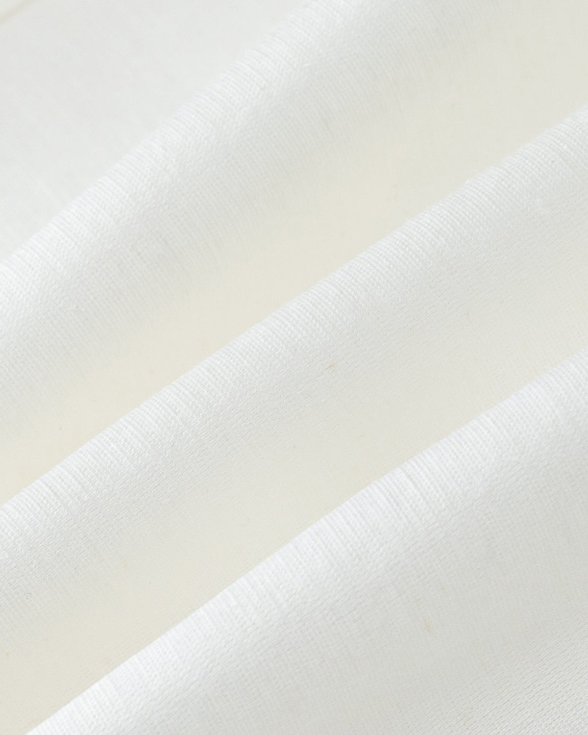 Juana Aven Wide Leg Pants in Pearl White (hemp–silk) textile close-up showing the woven texture and subtle luster.