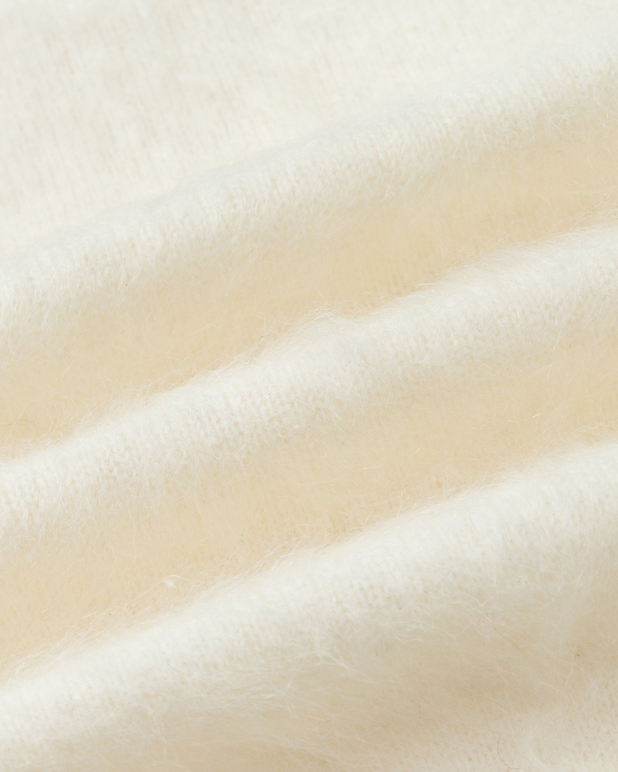 Juana Brushed Wool-Blend Cardigan in Ivory (wool–cashmere–silk blend) showing the hand-crafted brushed texture