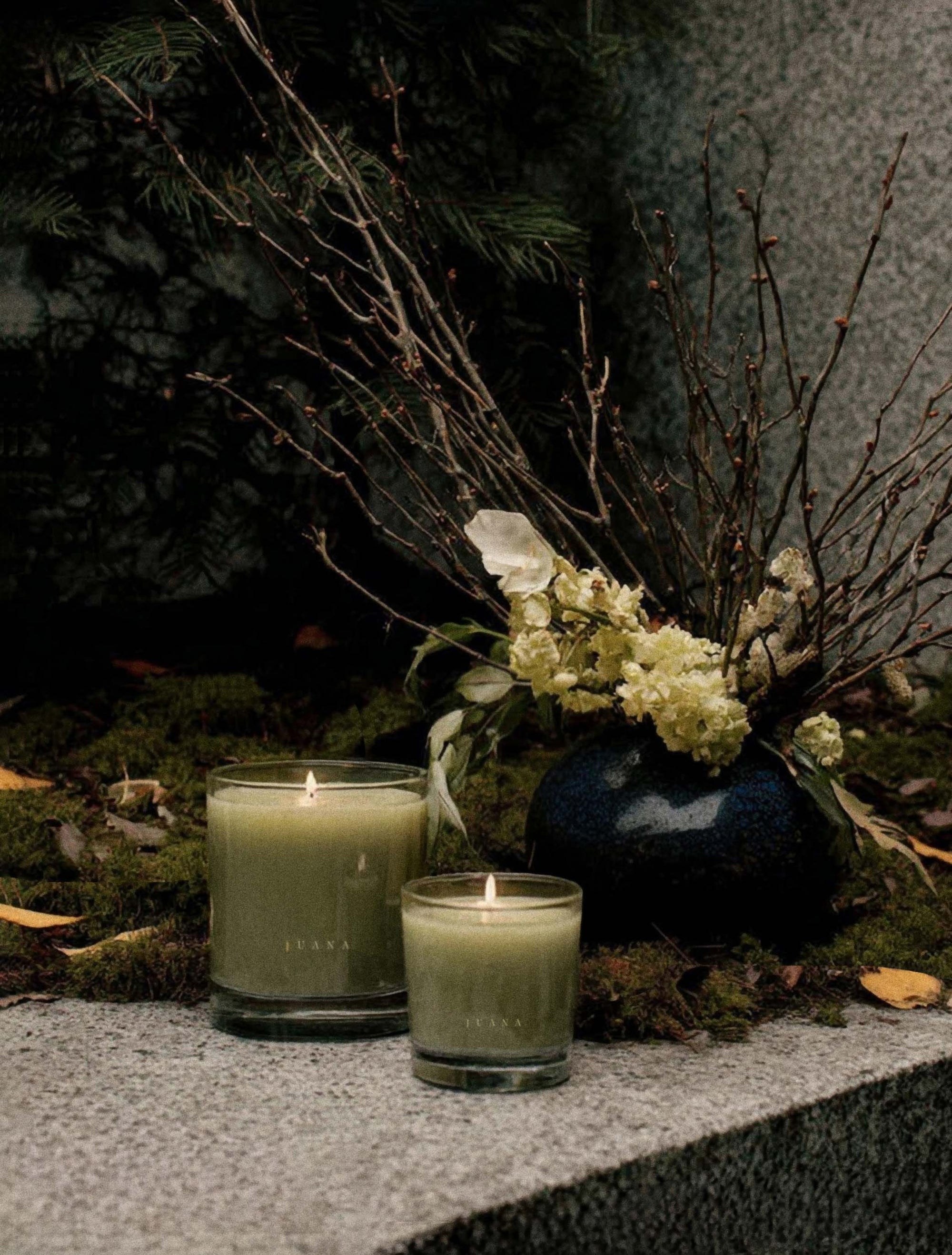 Juana Sage Indica Calm apothecary candles in two sizes on decorated table, vegan and eco-friendly.