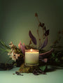 Juana Sage Indica Calm apothecary medium candle with ikebana-inspired botanical arrangement, crafted with vegan coco-apricot wax, eco-friendly.