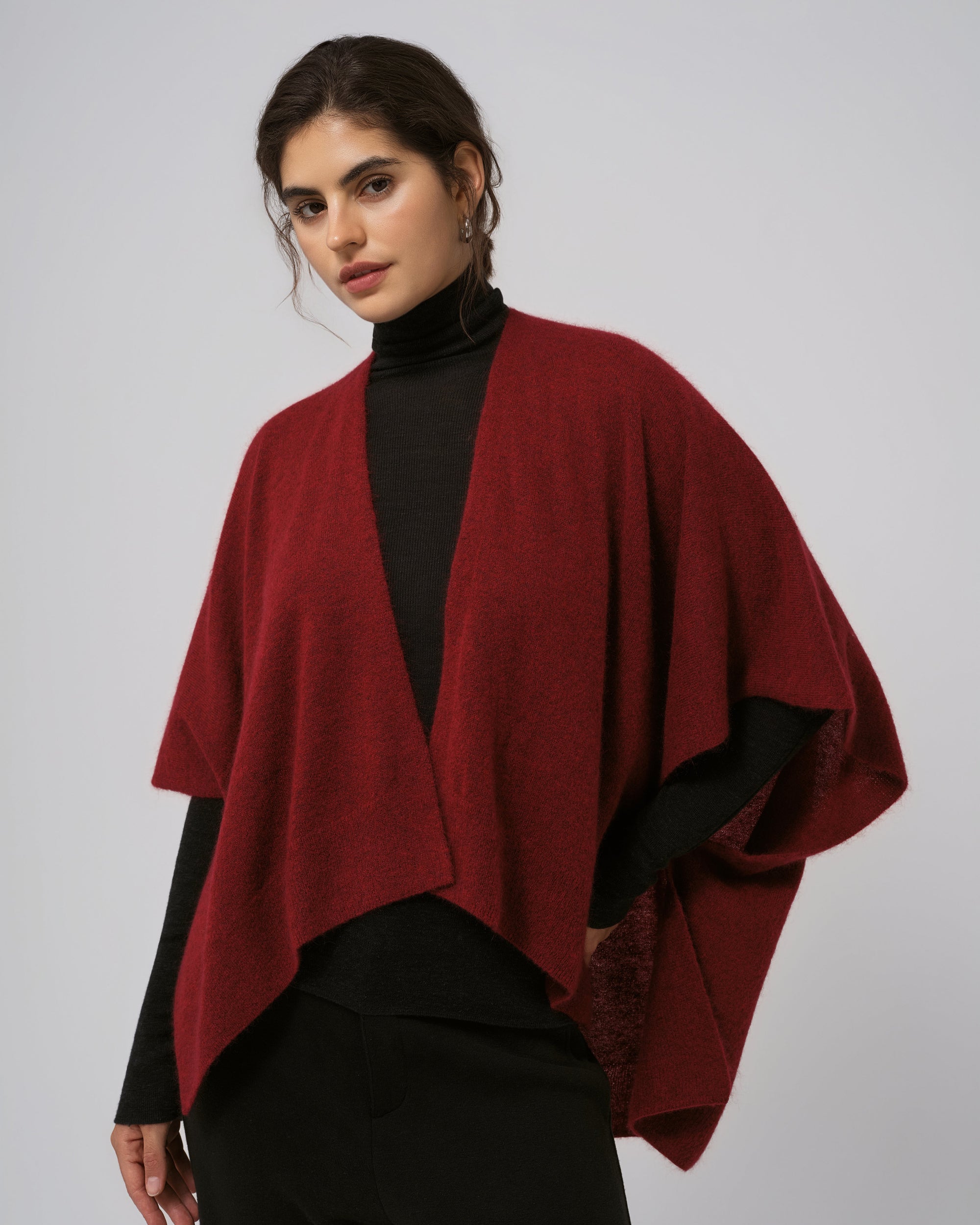 Detail of neckline and edge finish on burgundy wool–cashmere–hemp cape.