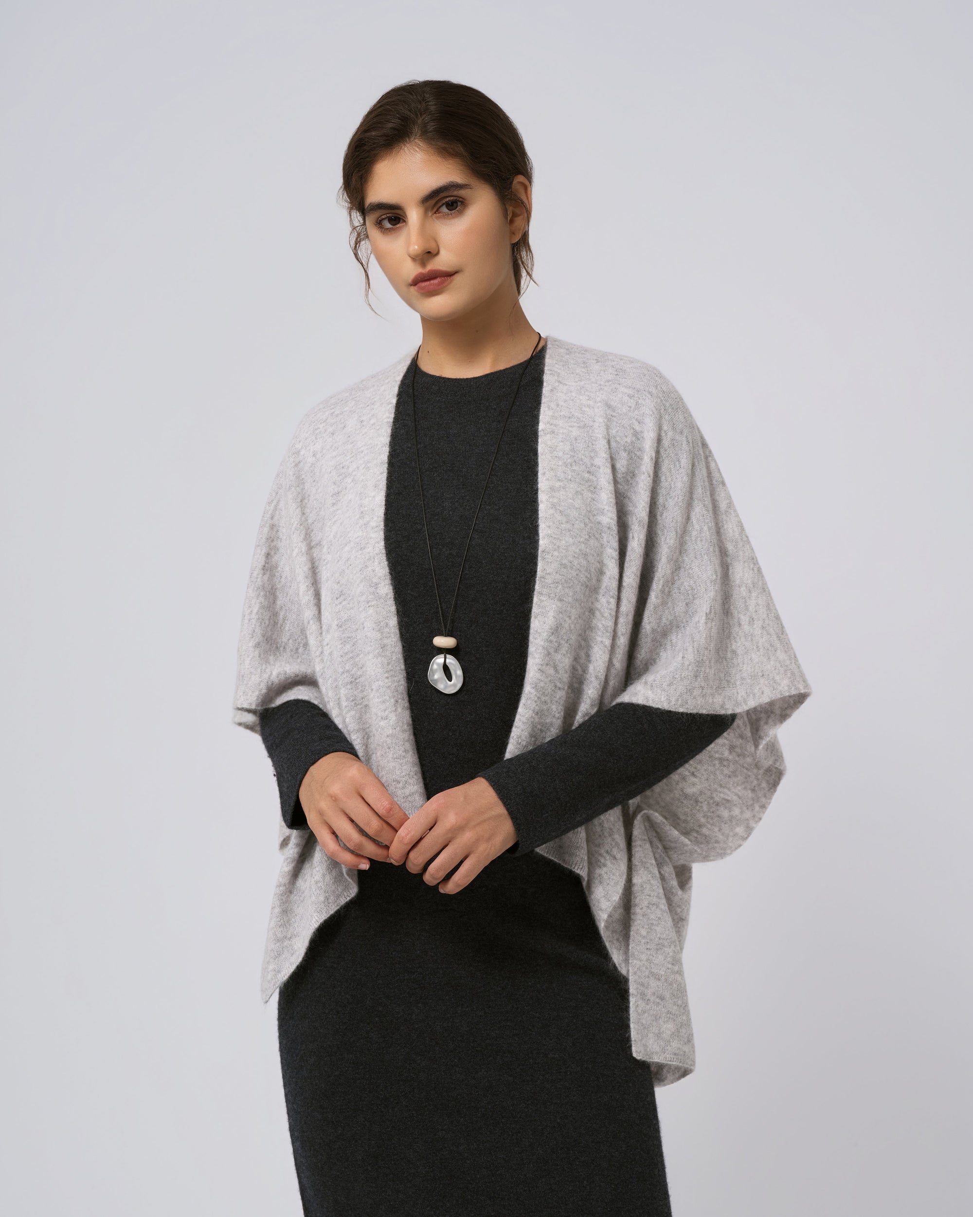Detail of neckline and edge finish on light grey wool–cashmere–hemp cape.