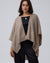 Detail shot of edge finish and knit texture on Juana Cashmere Cape (oatmeal), emphasizing quality and drape.