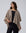 Detail shot of edge finish and knit texture on Juana Cashmere Cape (oatmeal), emphasizing quality.