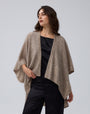 Detail shot of edge finish and knit texture on Juana Cashmere Cape (oatmeal), emphasizing quality.