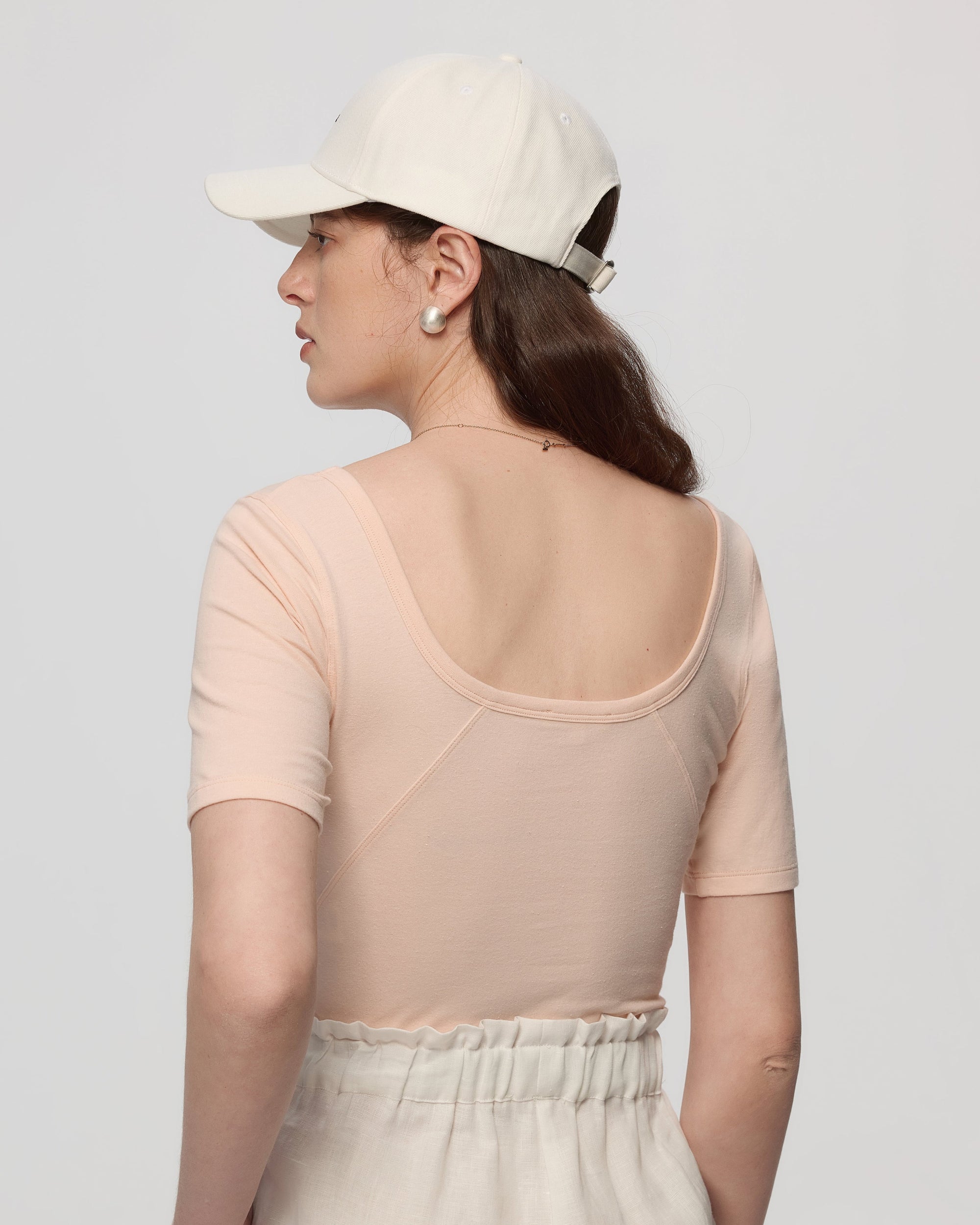Back view on model of square neckline and stitching on Classic Square Neck T-Shirt (peach).