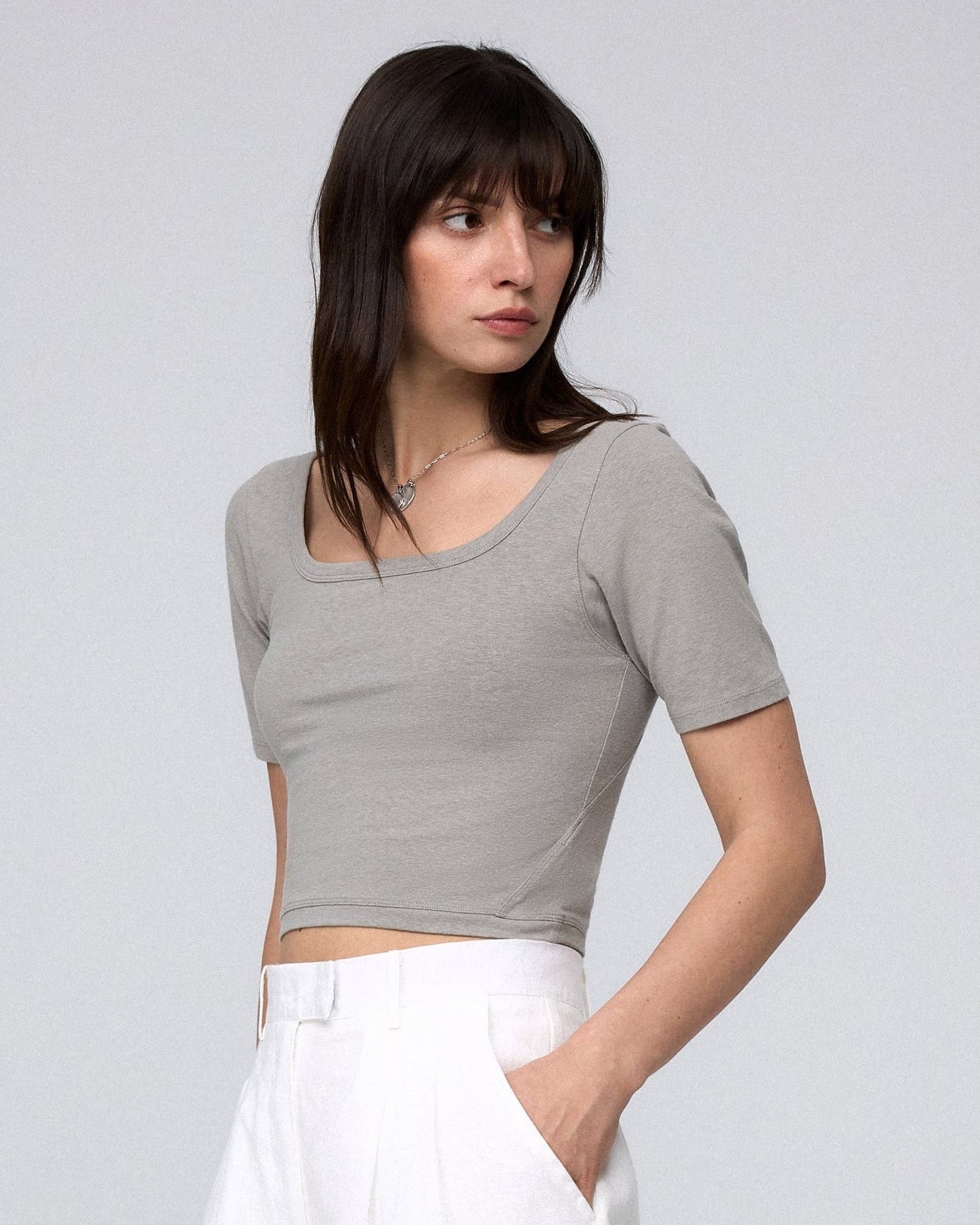 Two models styling Classic Square Neck T-Shirt (gray and black) with relaxed shorts for a polished, eco-friendly look.