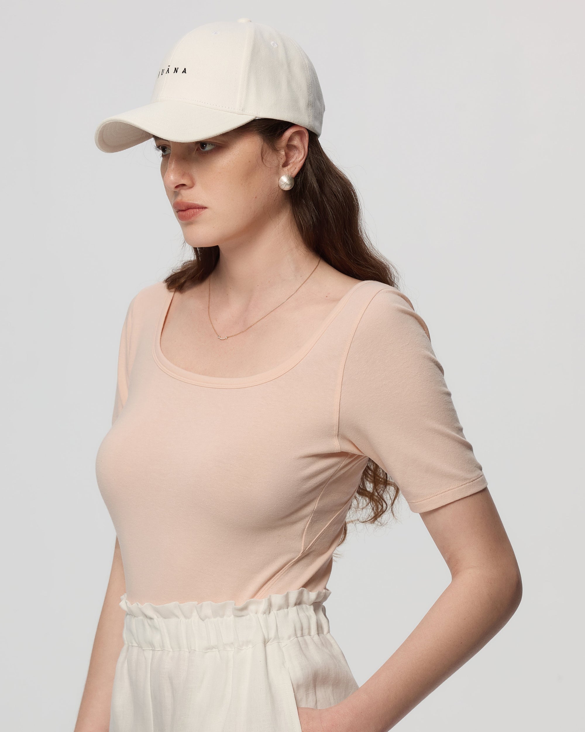 Side shot of square neckline and stitching on Classic Square Neck T-Shirt (peach).