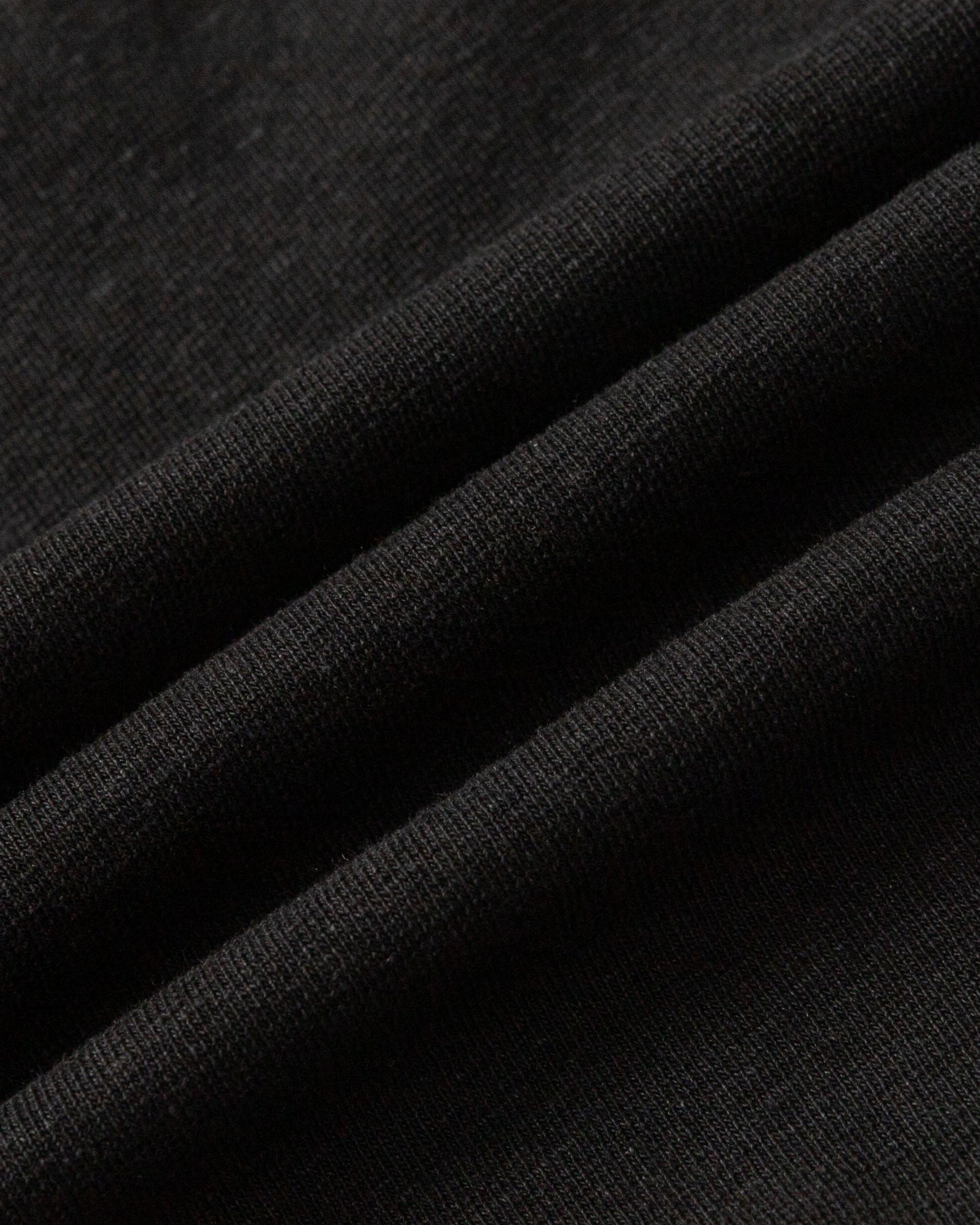 Close-up of hemp–organic cotton–spandex knit of Classic Square Neck T-Shirt (black), highlighting breathable texture.