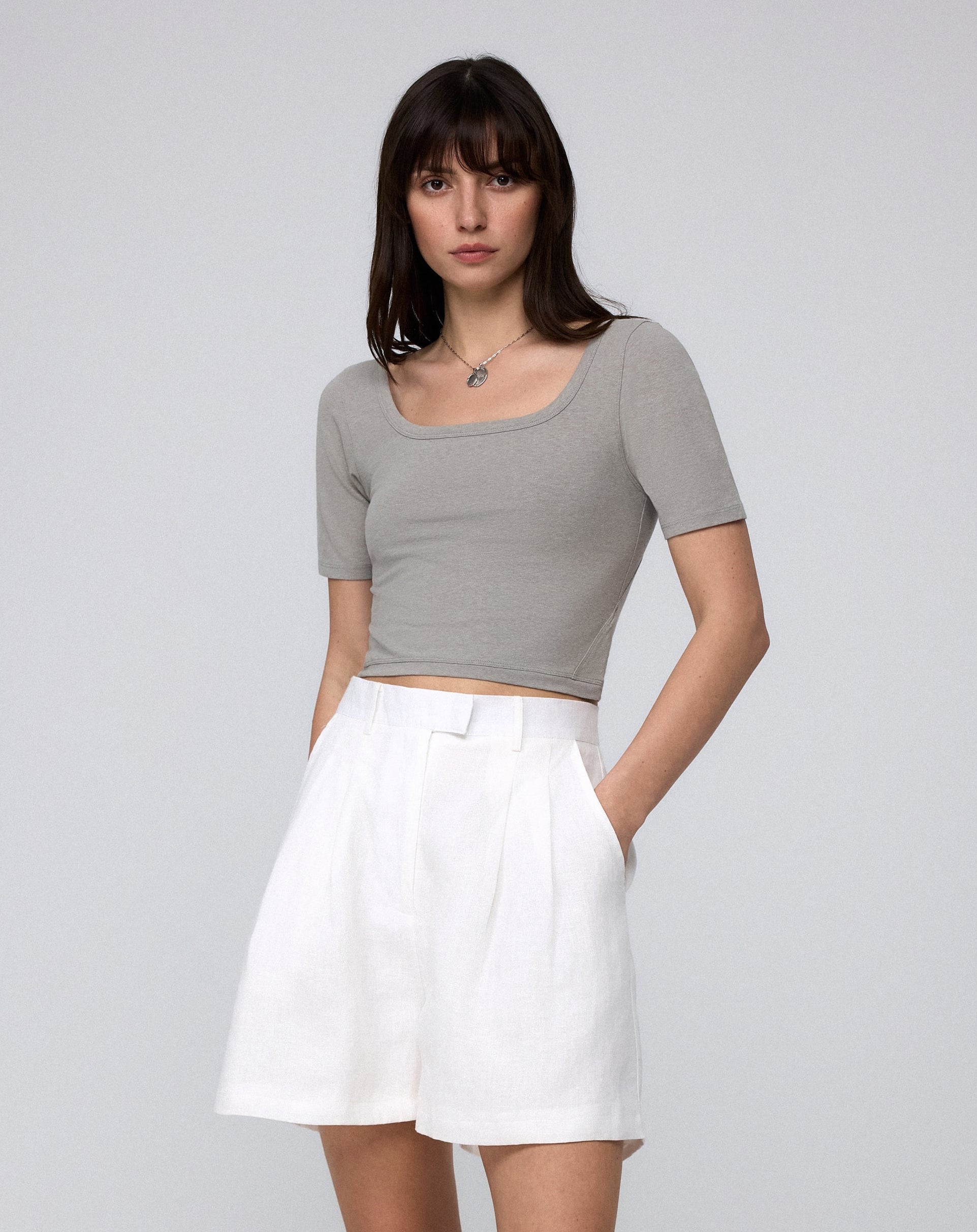 Woman wearing Juana Classic Square Neck T-Shirt in a hemp–organic cotton blend (gray), styled for sustainable everyday wear.