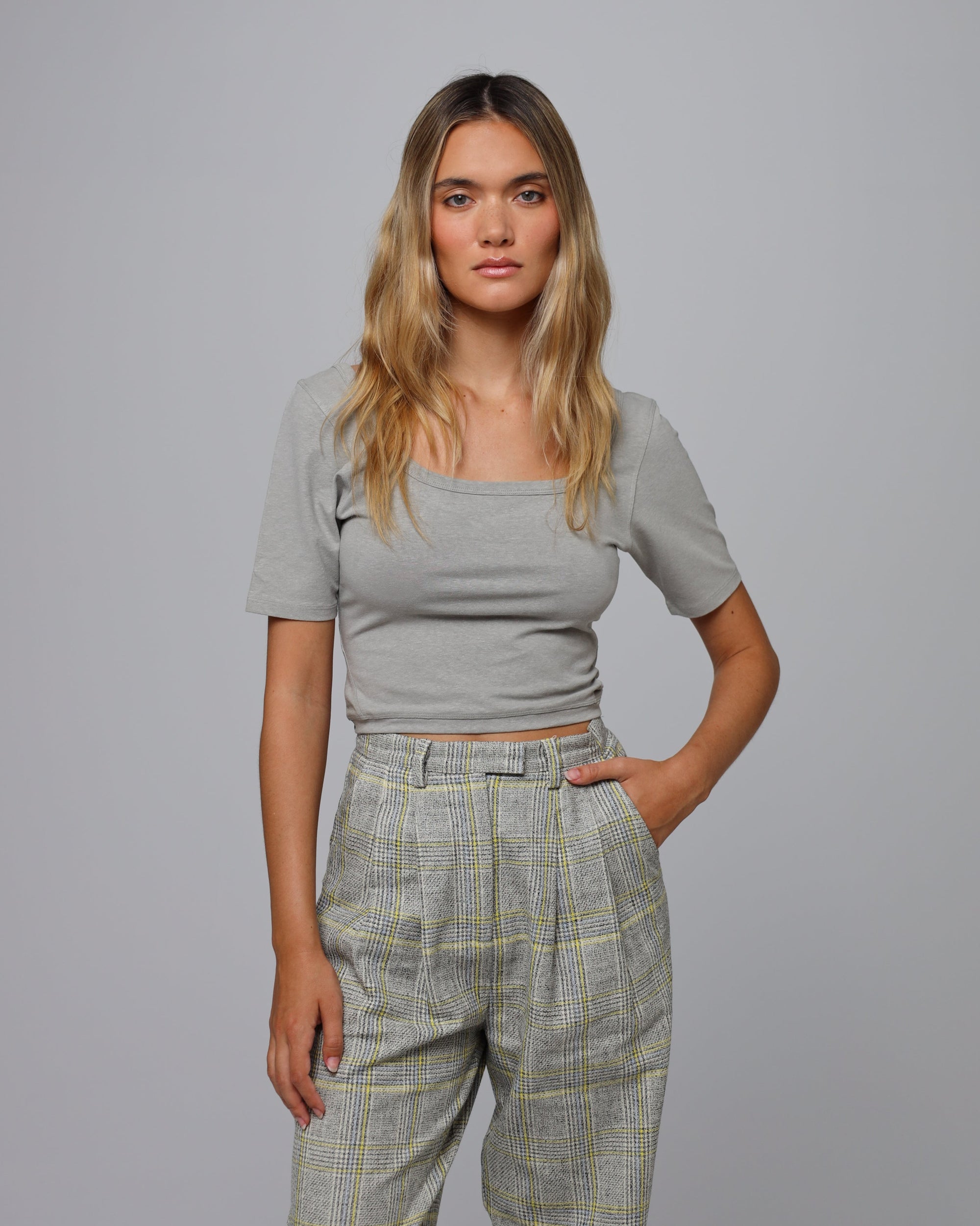 Woman wearing Juana Classic Square Neck T-Shirt in a hemp–organic cotton blend (grey), styled for sustainable everyday wear.