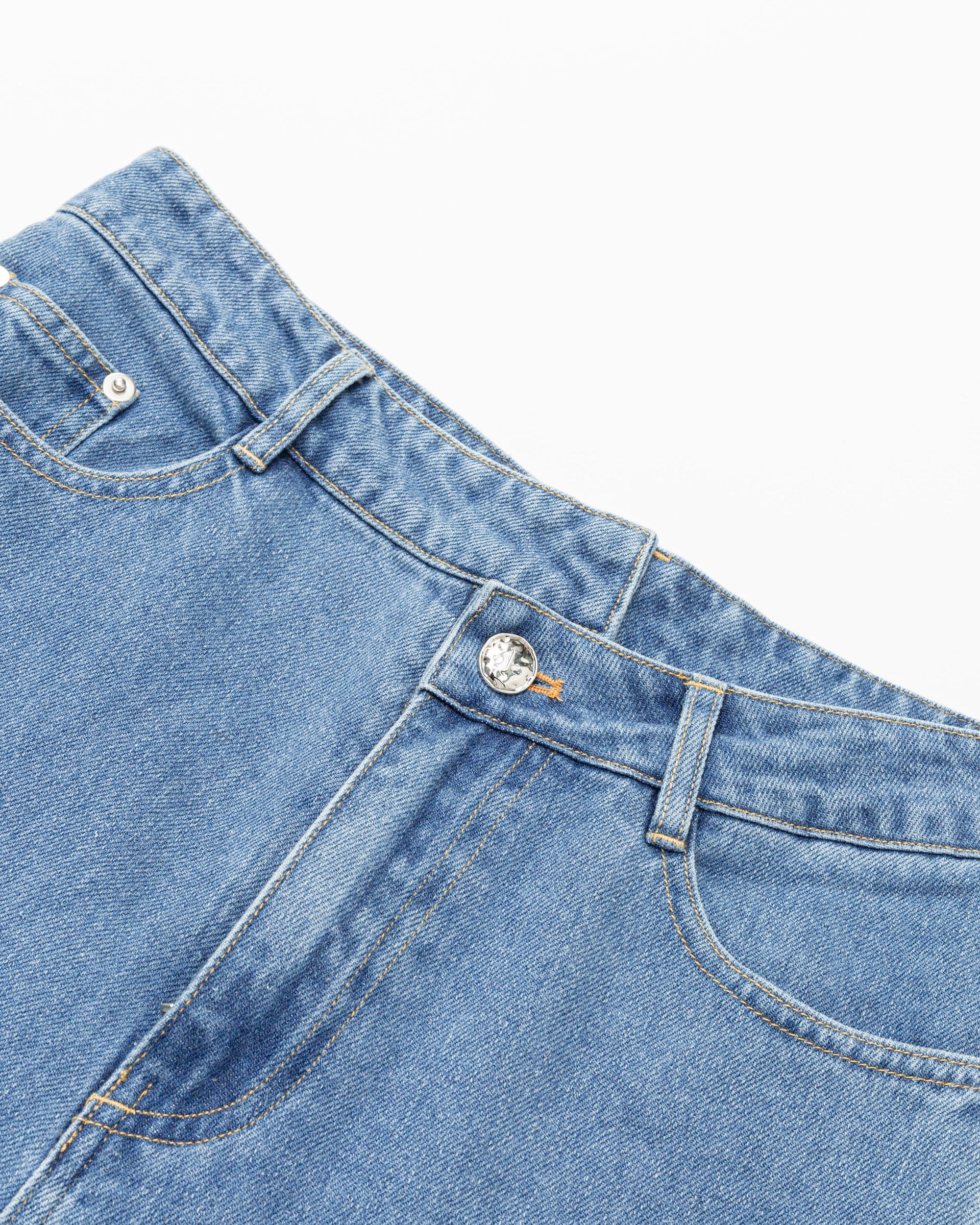 Juana Denim Atelier Crossover Jeans light blue denim (cotton–hemp) layflat view with crossover waistband