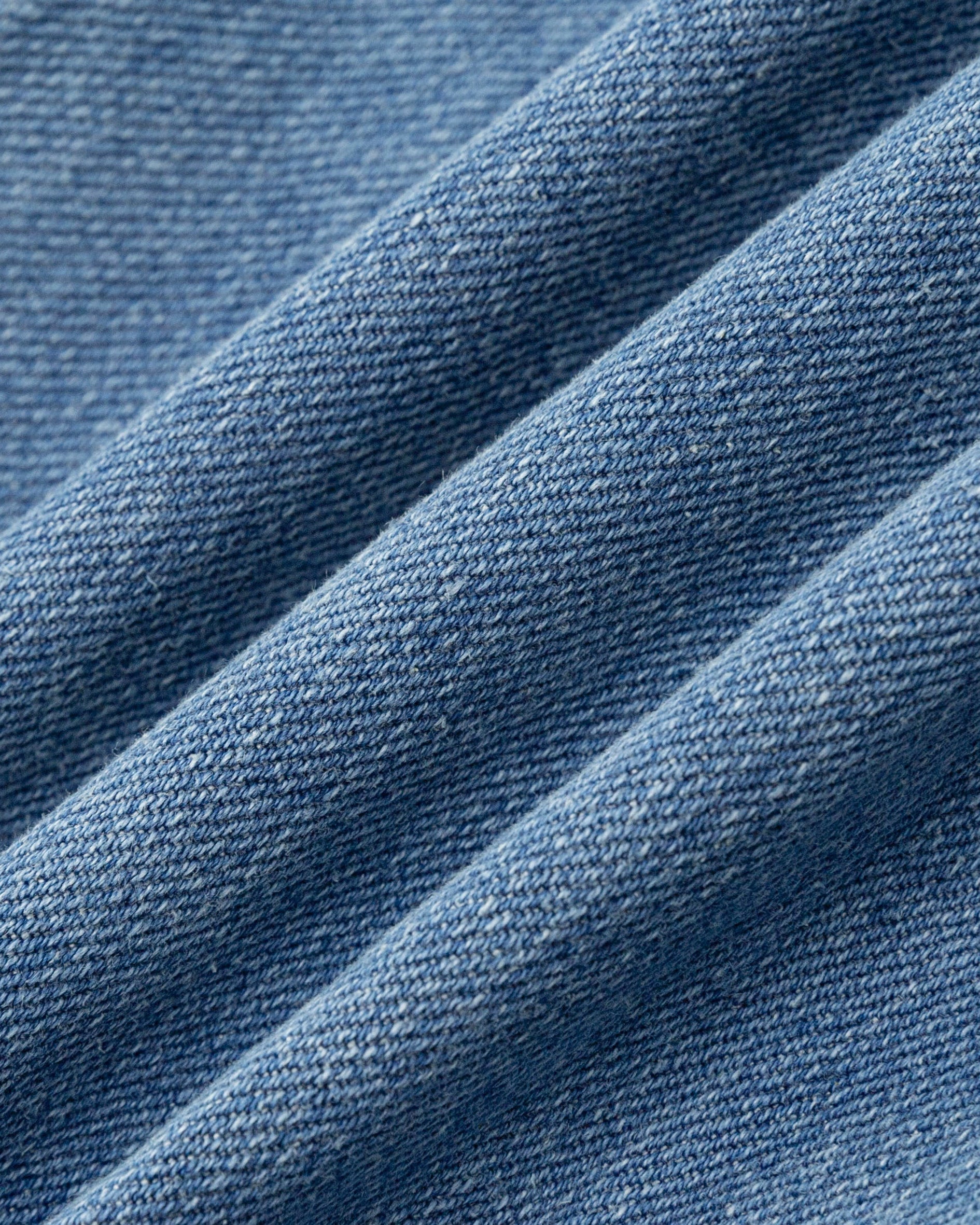 Juana Denim Atelier Flare Jeans light blue denim (cotton–hemp blend) textile close-up showing denim texture