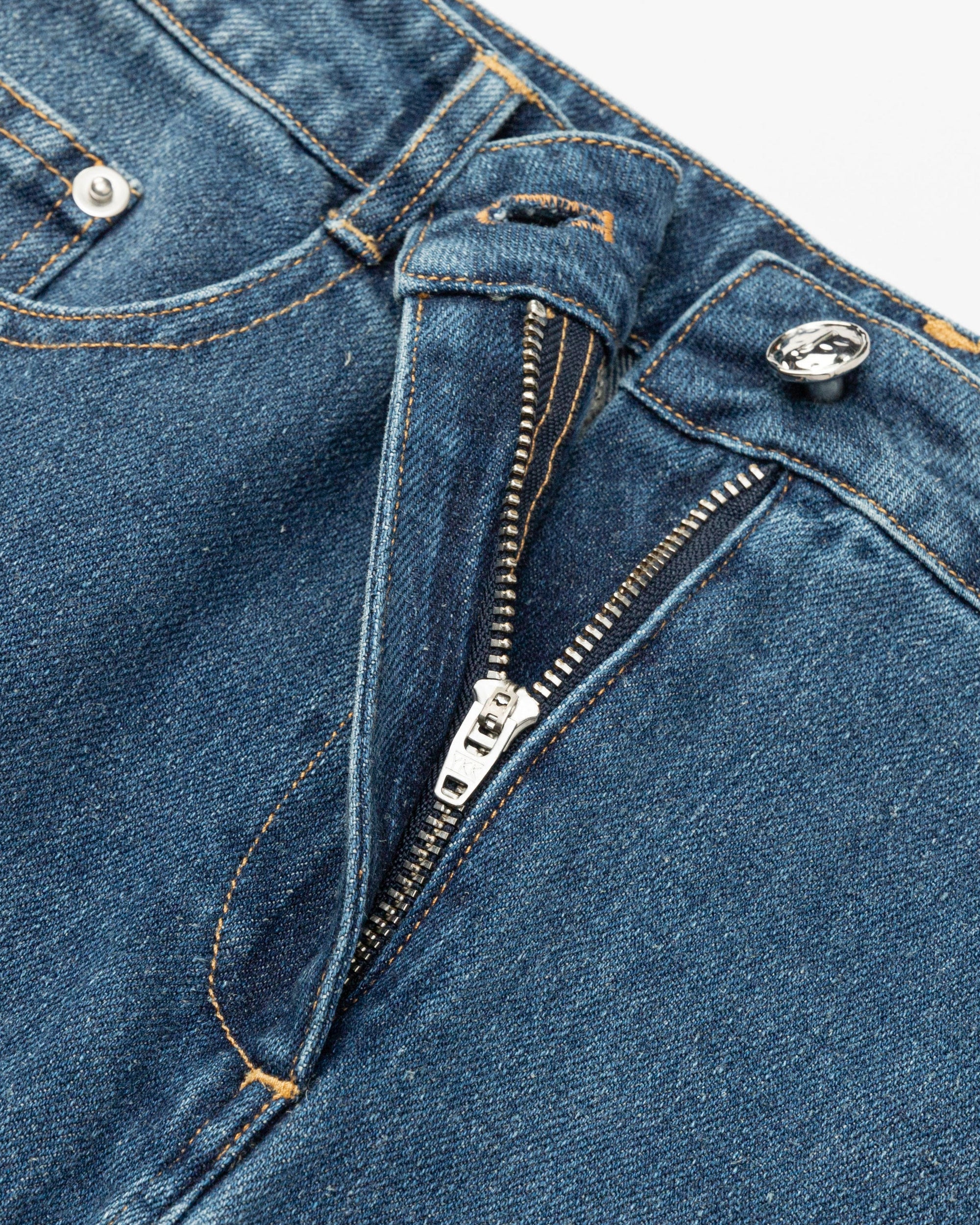 Juana Denim Atelier Midi Skirt Medium Indigo (hemp–cotton) layflat detail highlighting zipper. button, and stitching