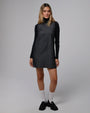 Model wearing Juana Denim Atelier Shift Dress in black denim (hemp–organic cotton), showcasing a clean, minimalist silhouette.