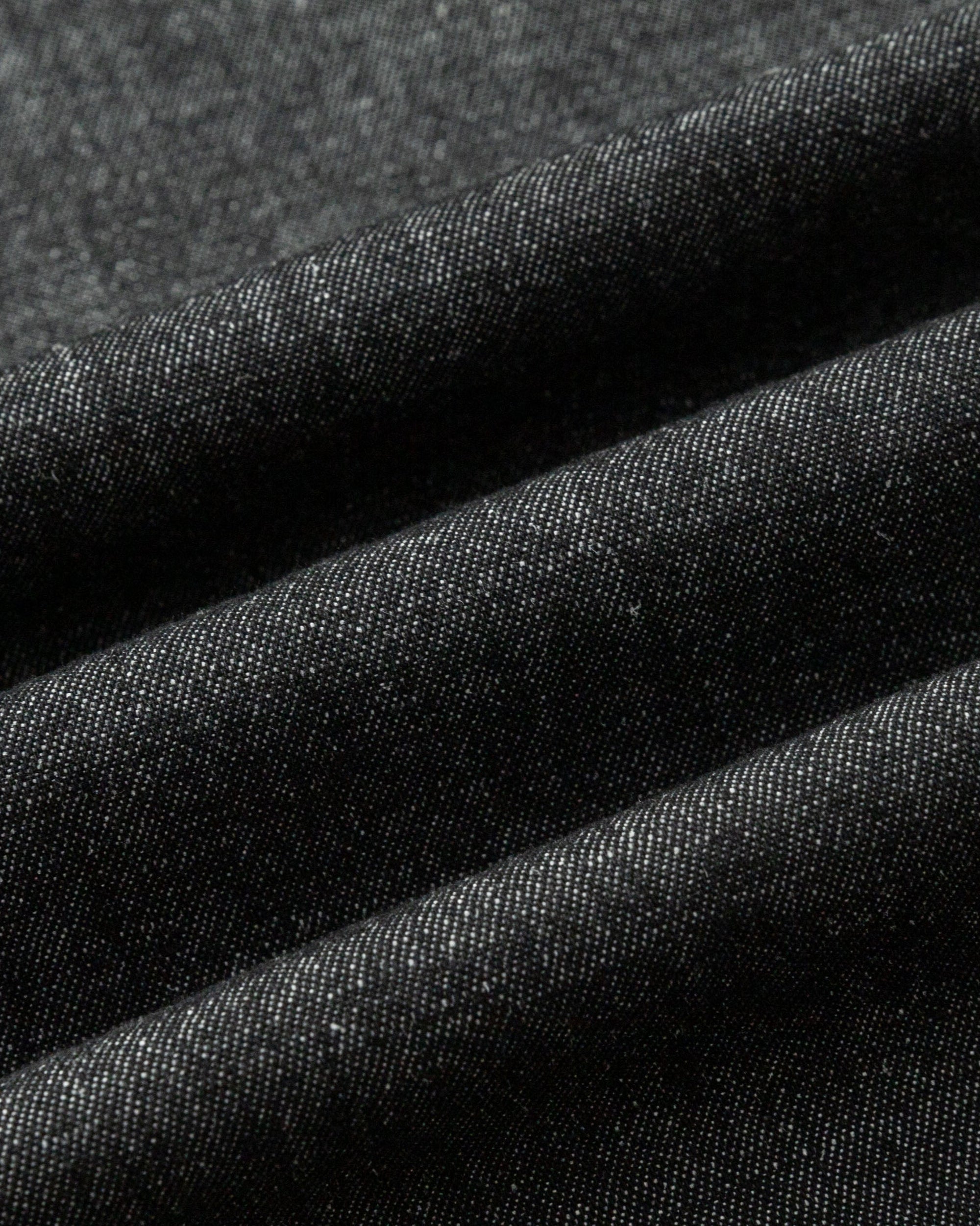 Close-up of hemp–organic cotton denim fabric of the Shift Dress (black denim), highlighting breathable, durable weave.
