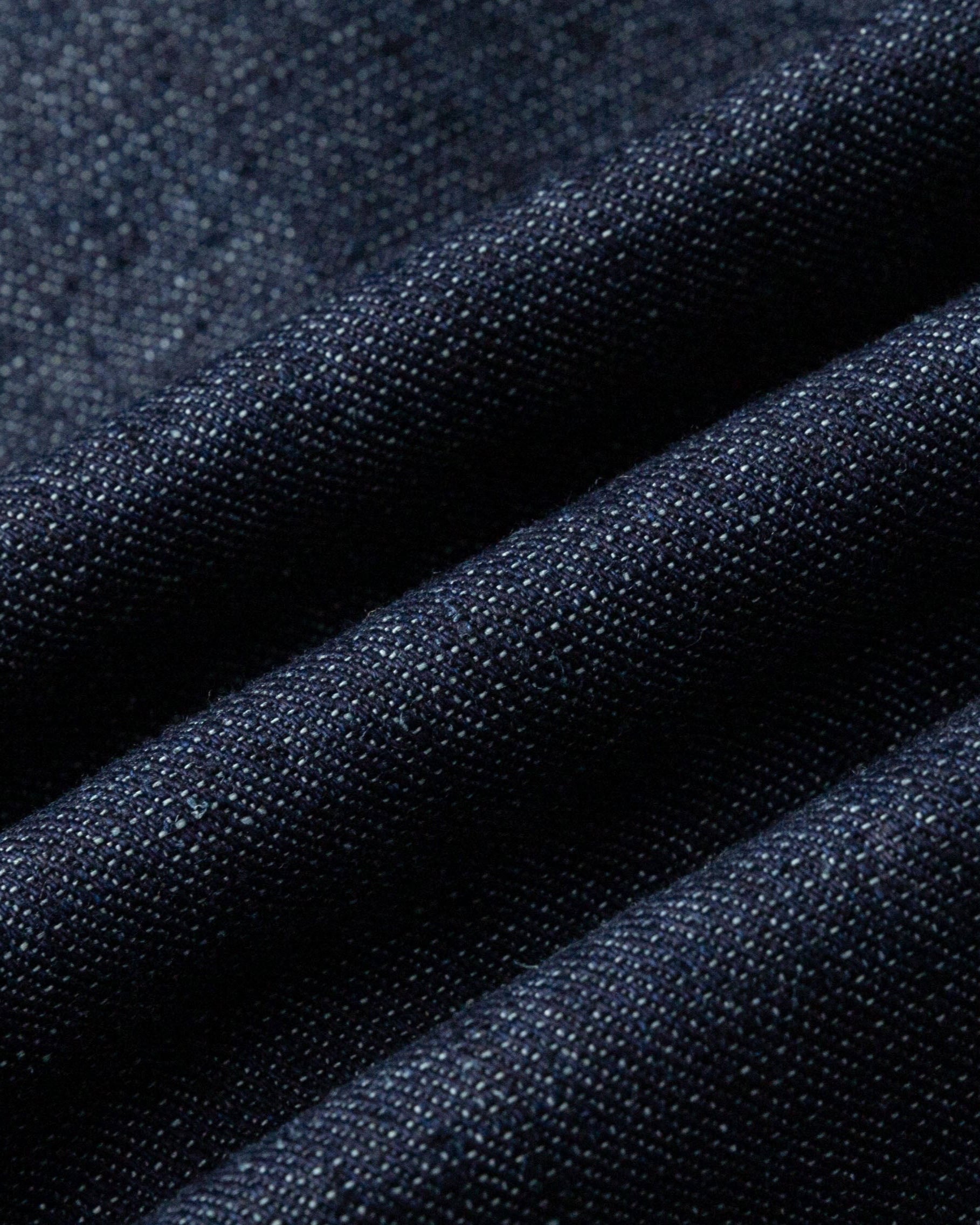 Close-up of hemp–organic cotton denim fabric of the trench (indigo denim), highlighting breathable, durable weave.