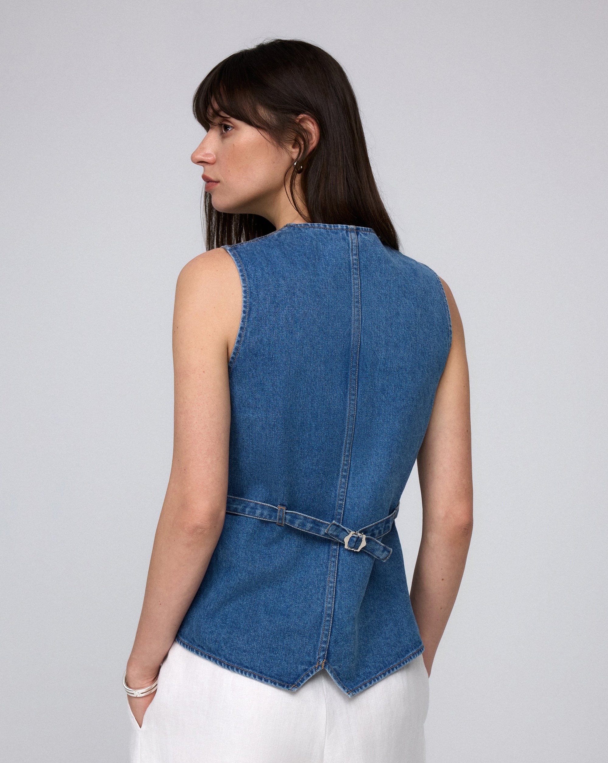 Juana Denim Atelier Vest light blue denim (hemp–cotton) model back view with adjustable back cinch