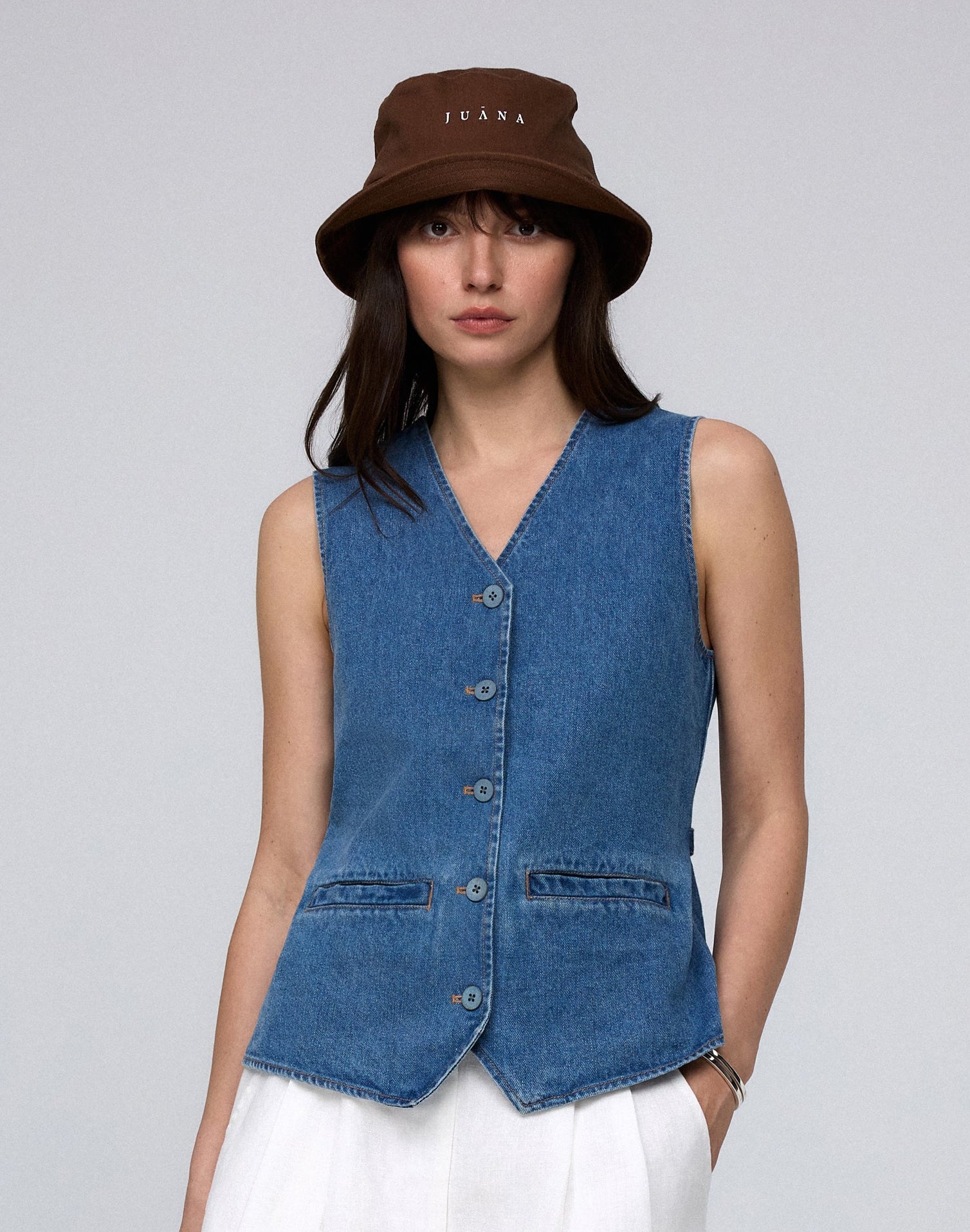 Juana Denim Atelier Vest light blue denim (hemp–cotton) model look 2 showing front corozo button closure