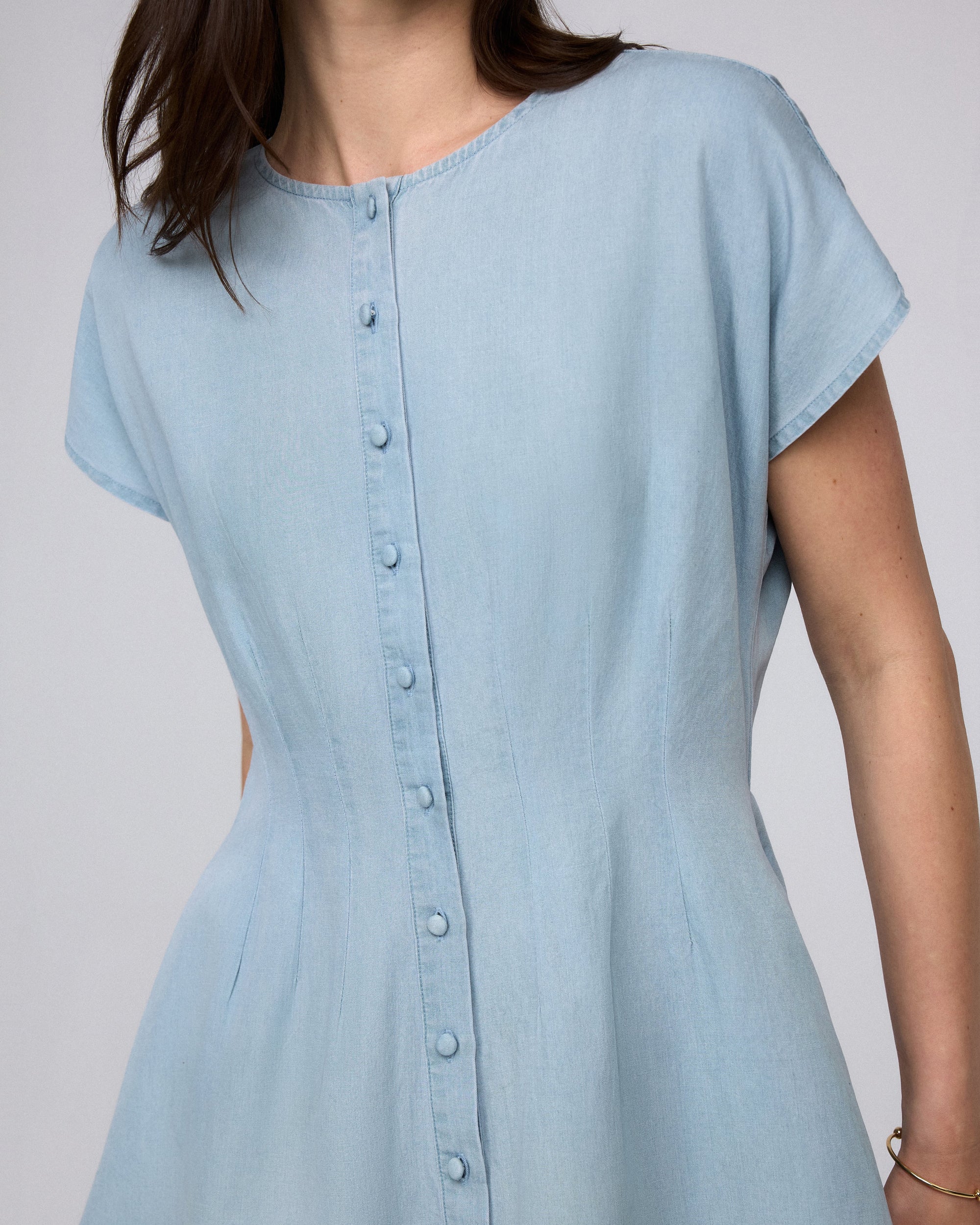 Juana Faye Pleated Shirt Dress chambray blue (Tencel–cotton–hemp blend) detail view showing covered buttons and hidden side pockets