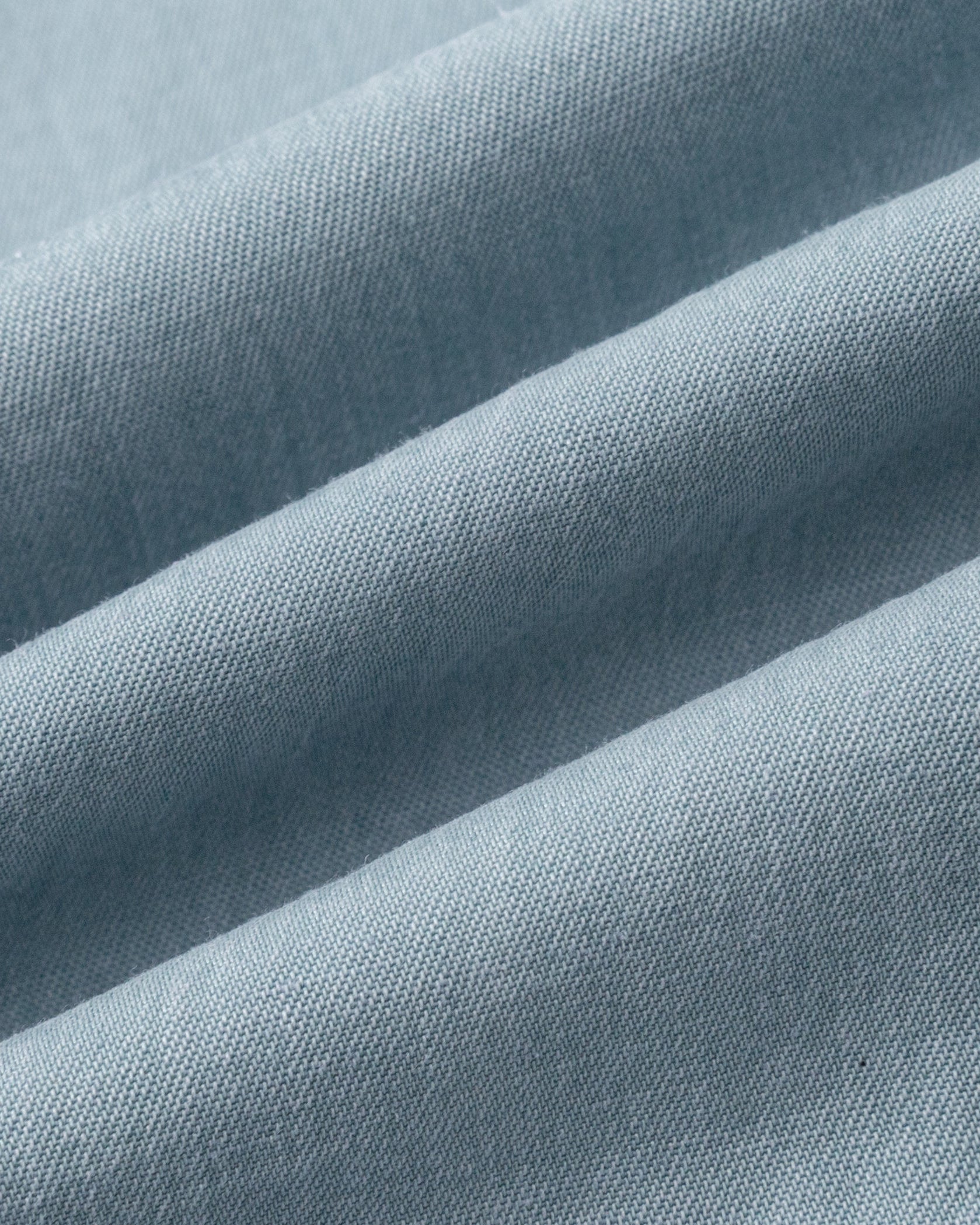 Juana Faye Pleated Shirt Dress chambray blue (Tencel–cotton–hemp blend) textile close-up showing lightweight chambray texture